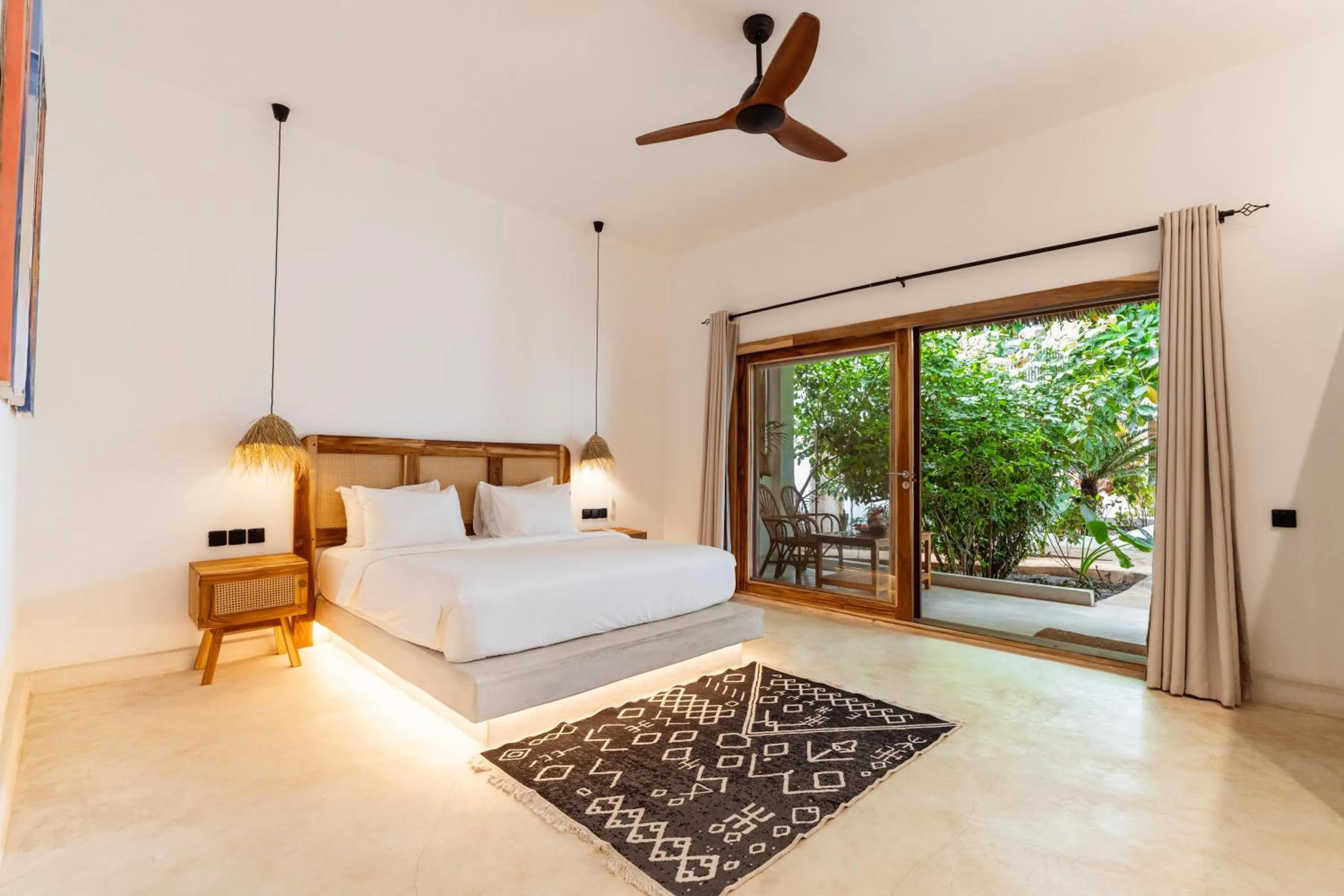 Bed in LUJO Zanzibar Resort