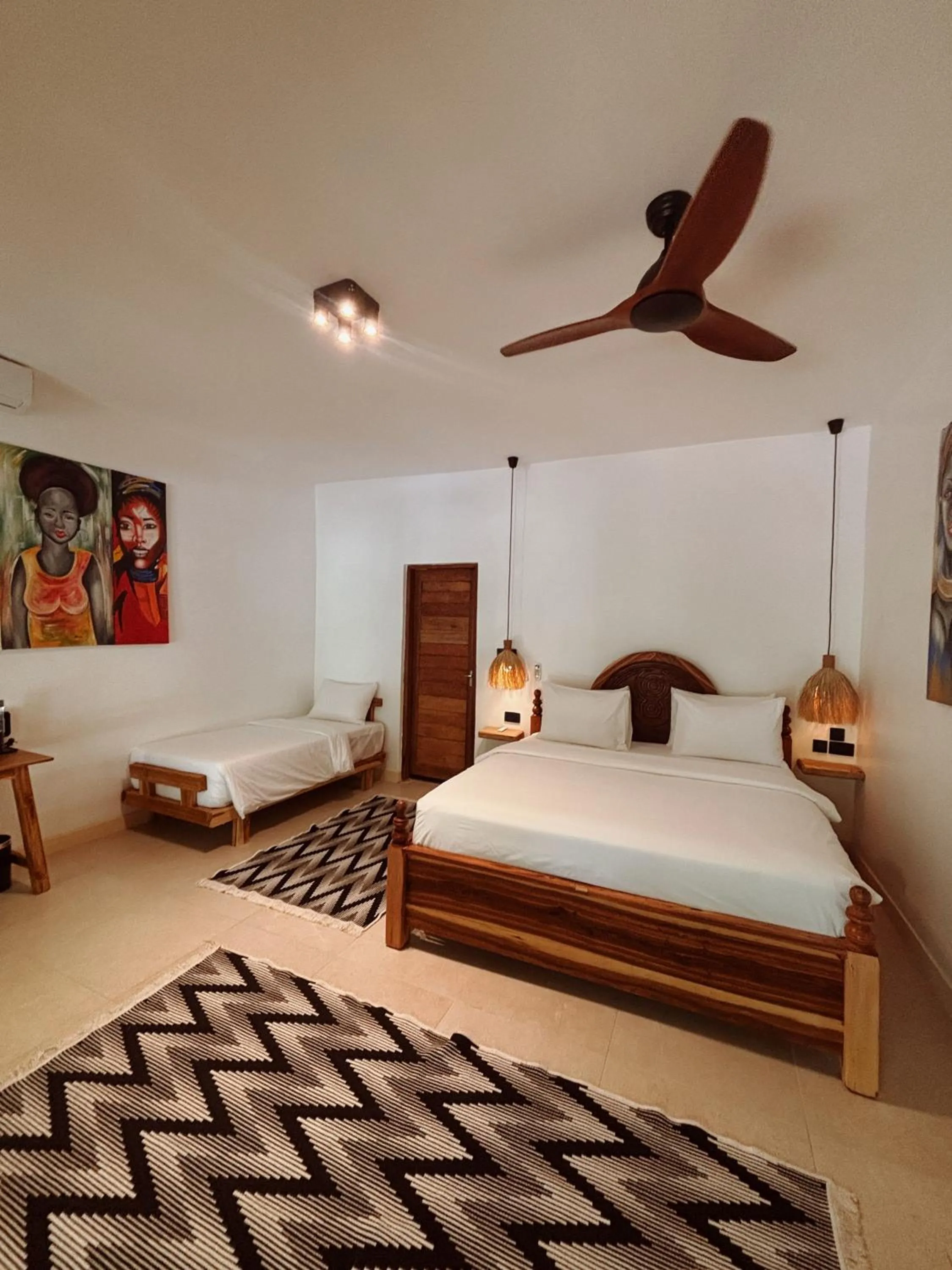Bed in LUJO Zanzibar Resort