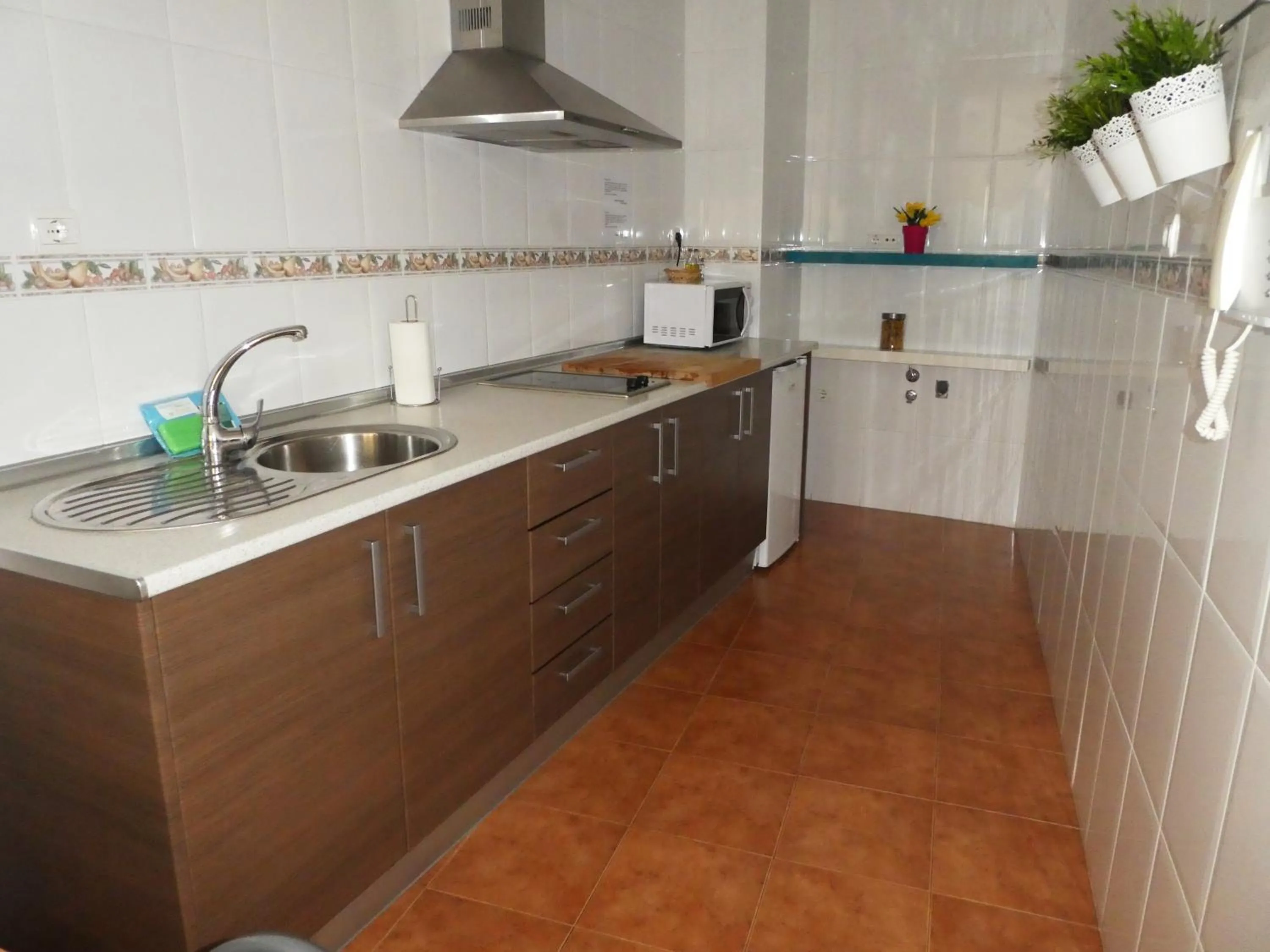 Kitchen or kitchenette in Apartamentos Catedral Plaza 3000