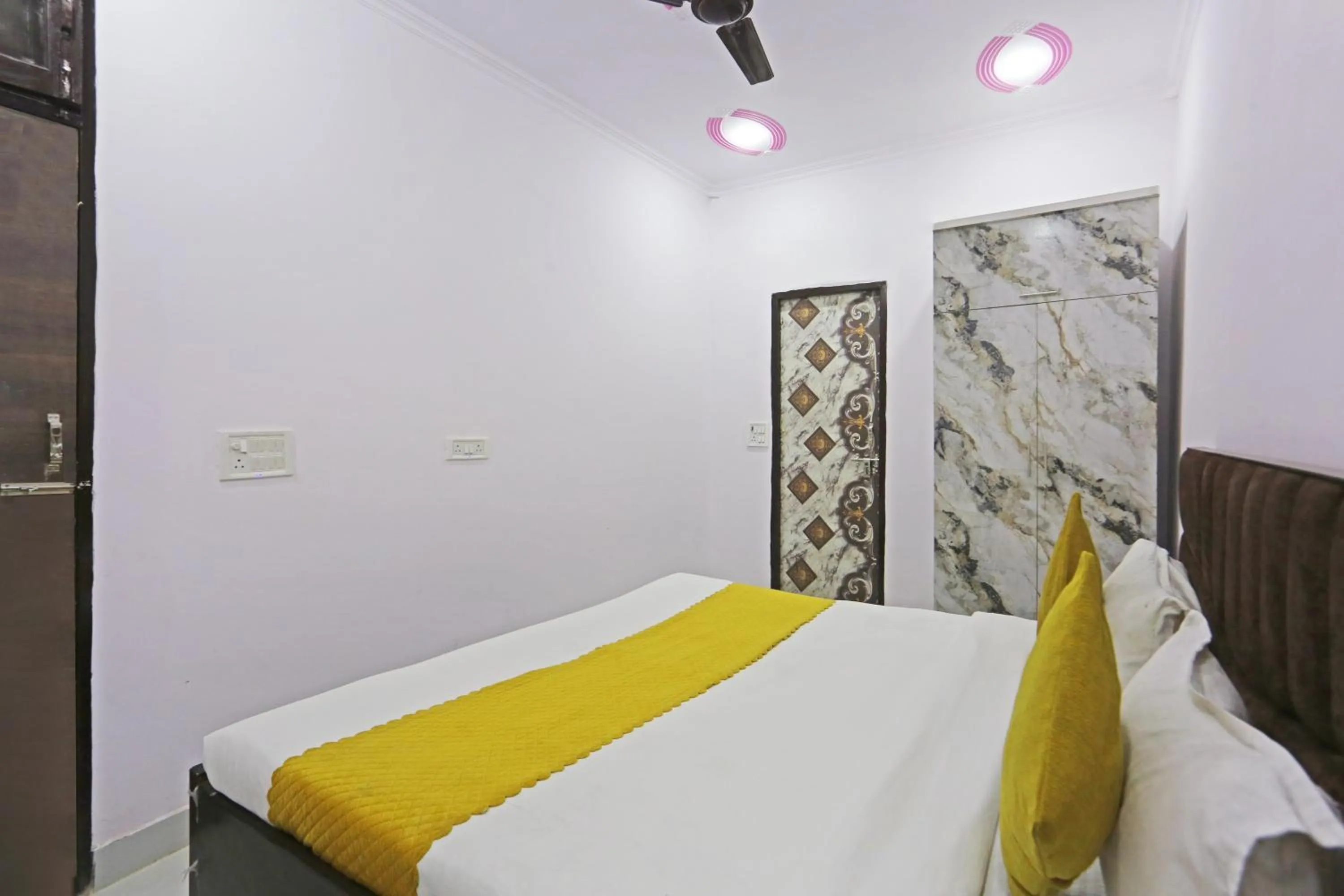 Bed in Twamev Residency