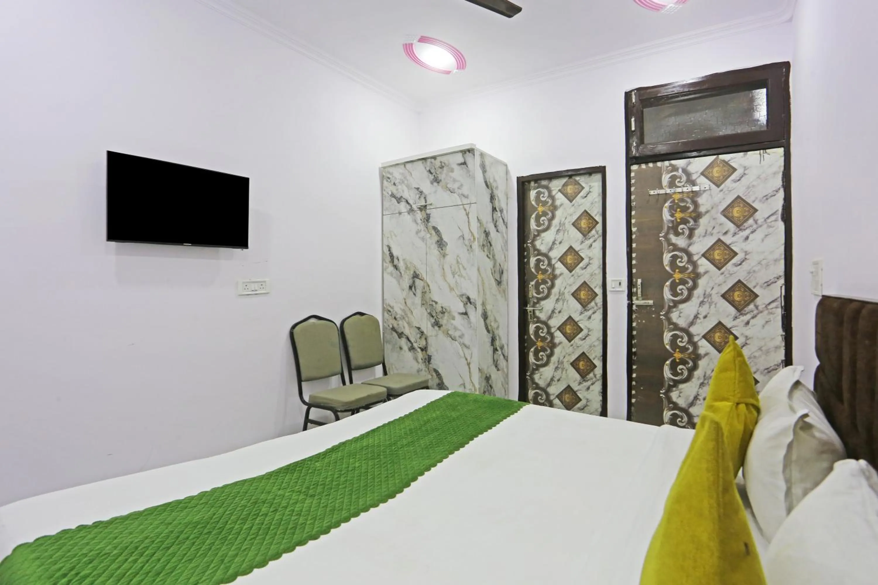 Bed in Twamev Residency