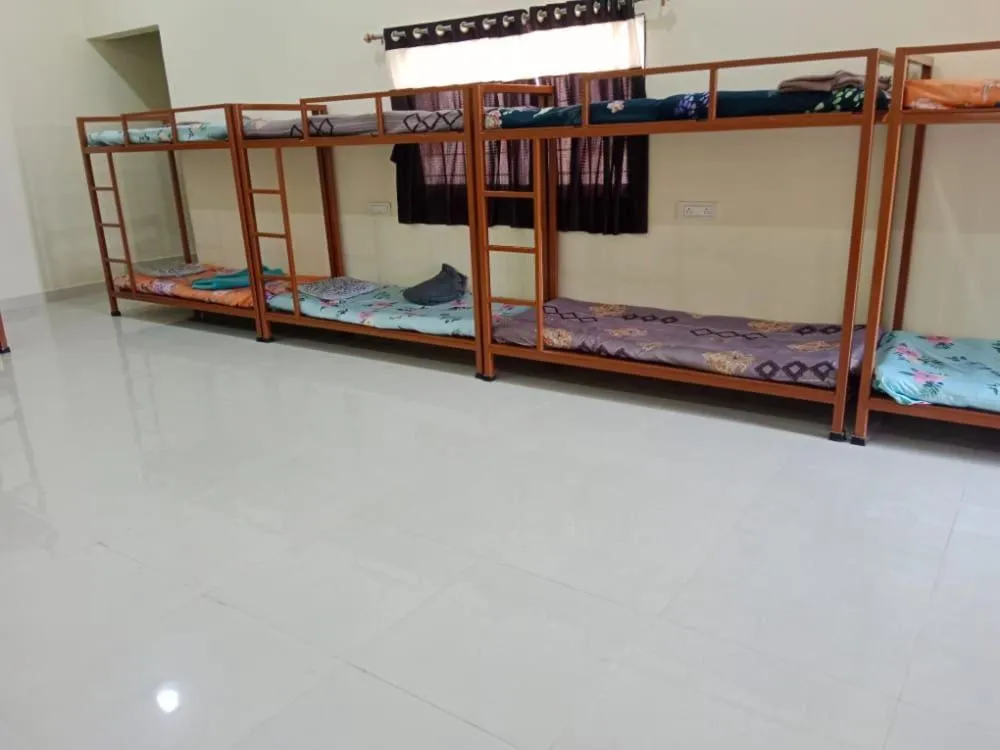 Bed in Madhura Agro Tourism