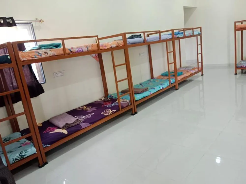 Bed in Madhura Agro Tourism