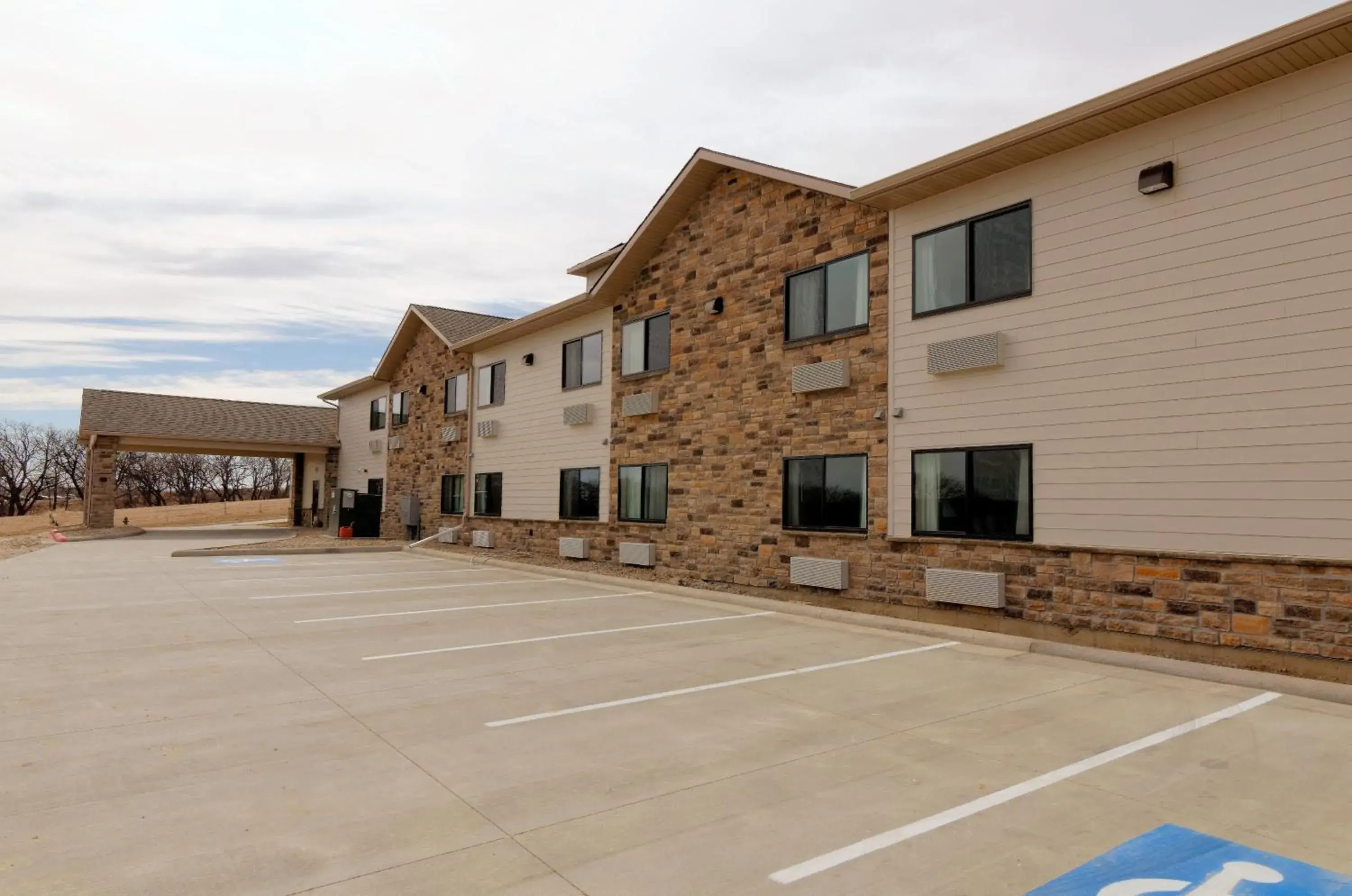 Property building in Cobblestone Inn & Suites - Denison | Oak Ridge Property building in Cobblestone Inn & Suites - Denison | Oak Ridge