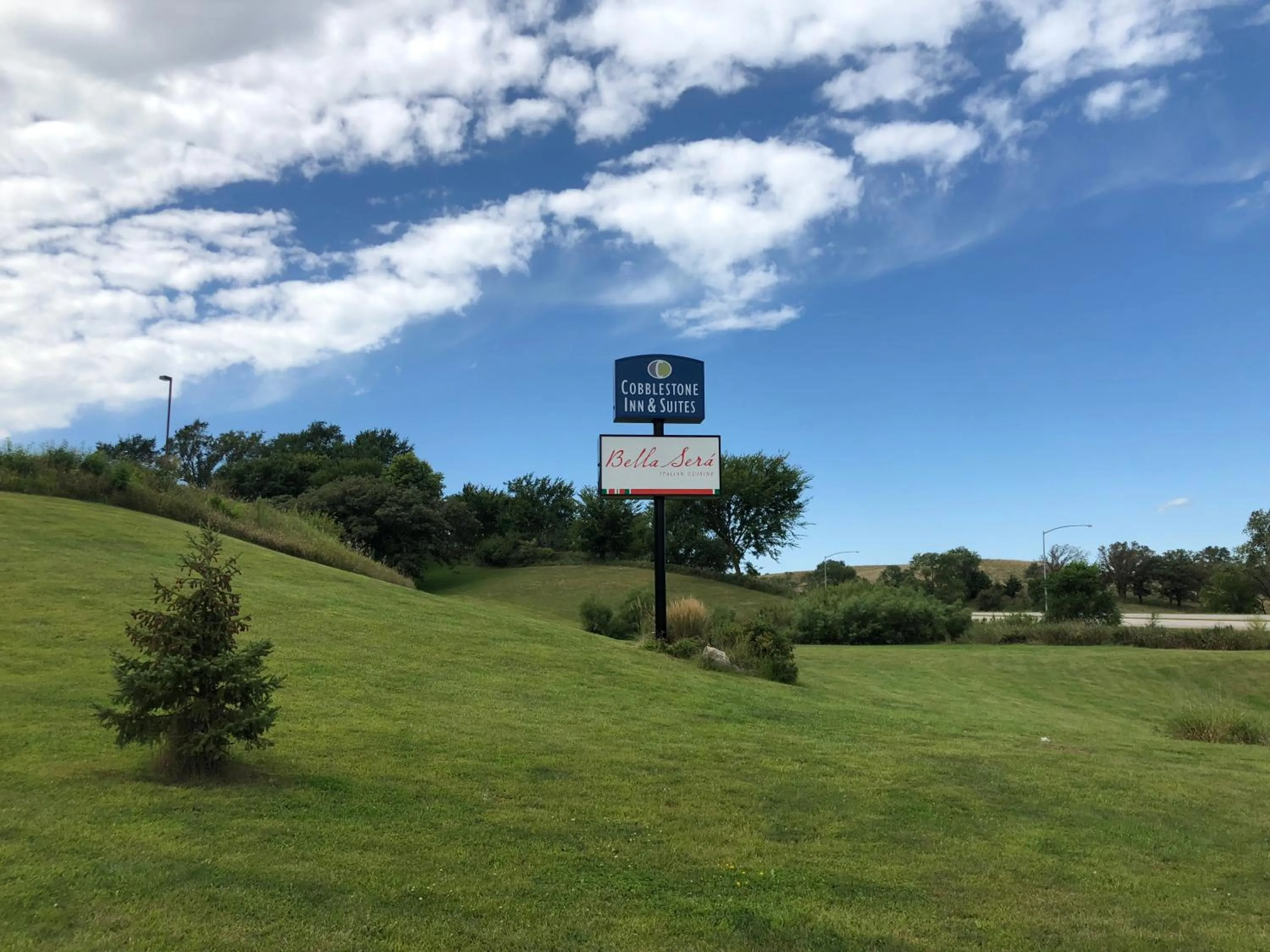 Property logo or sign in Cobblestone Inn & Suites - Denison | Oak Ridge