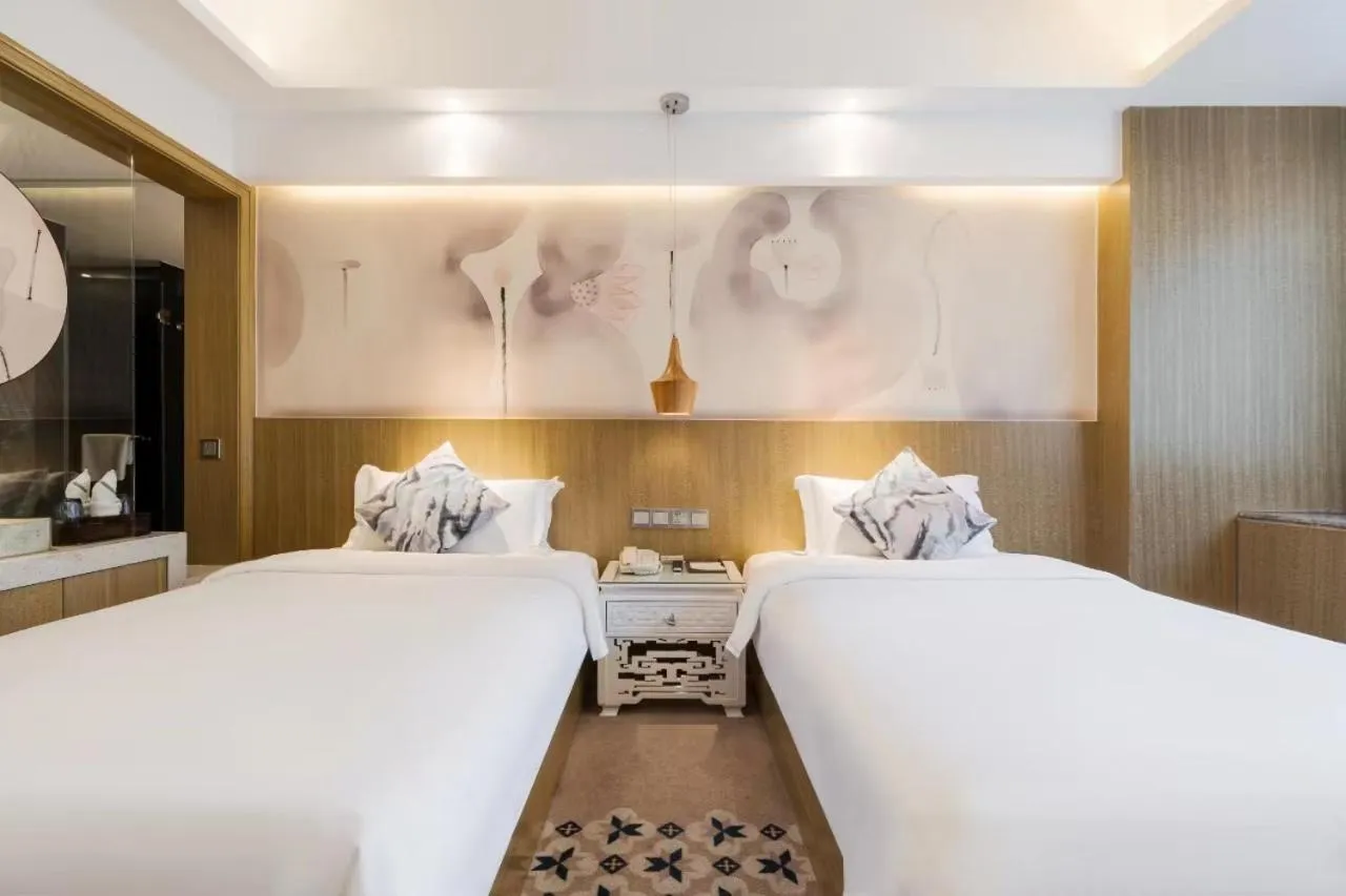 Bed in Paco Hotel Tianpingjia Metro Guangzhou