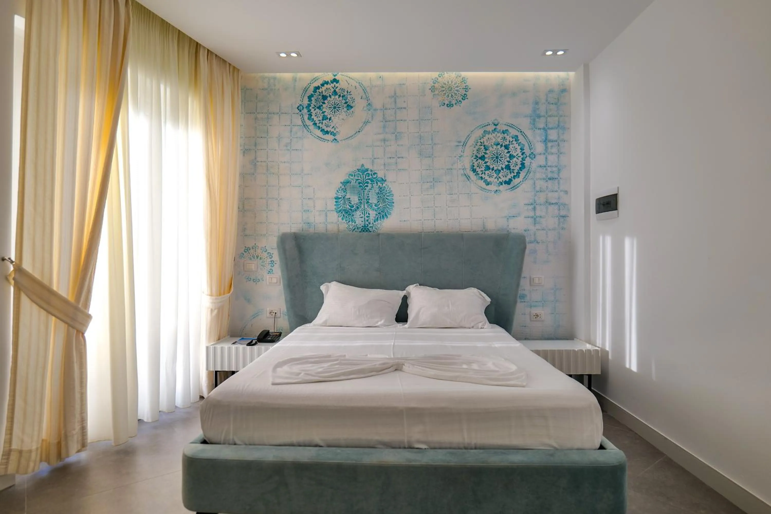 Bed in HH Boutique Hotel