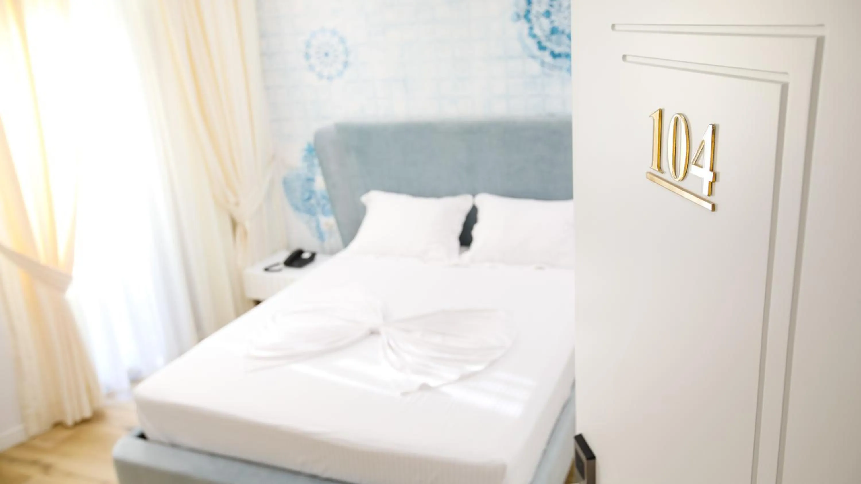 Bed in HH Boutique Hotel