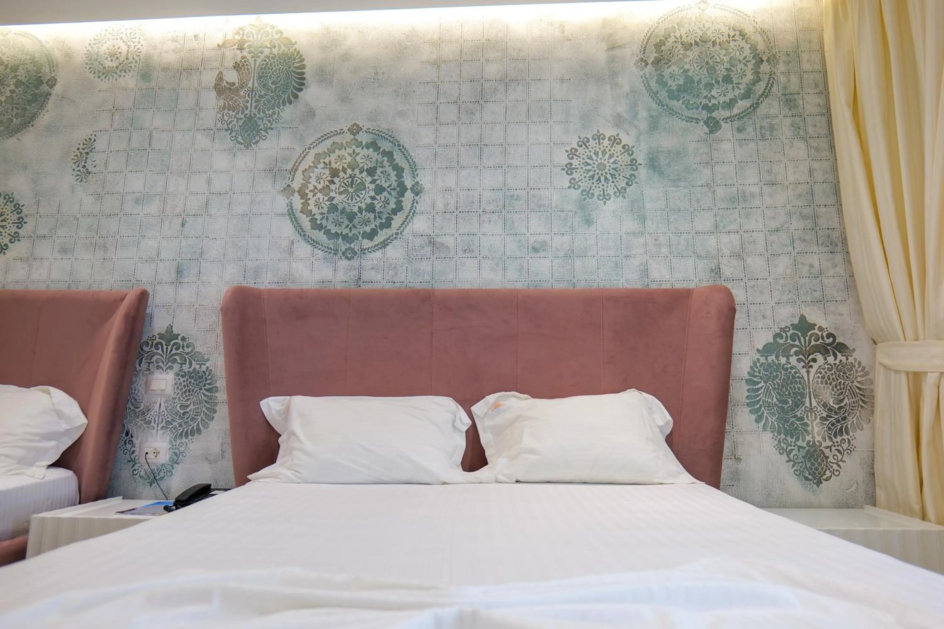 Bed in HH Boutique Hotel