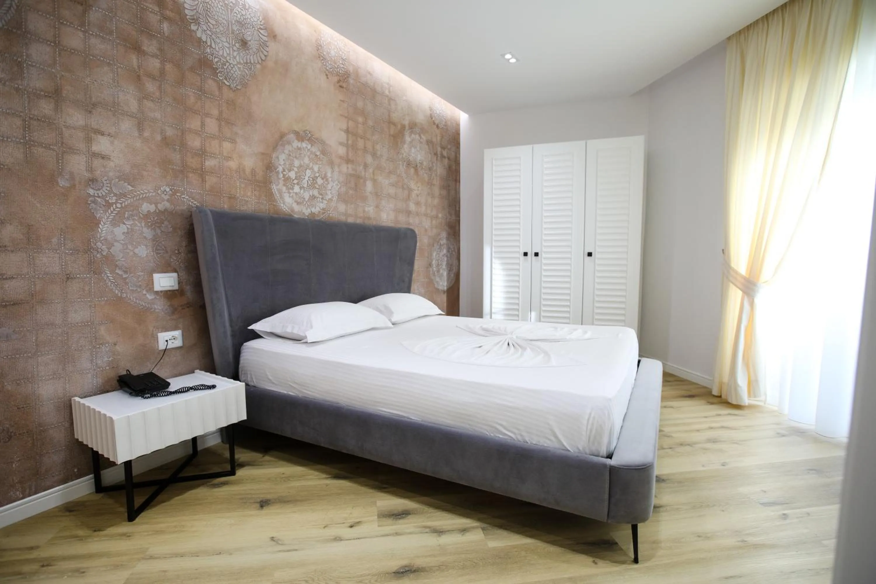 Bed in HH Boutique Hotel