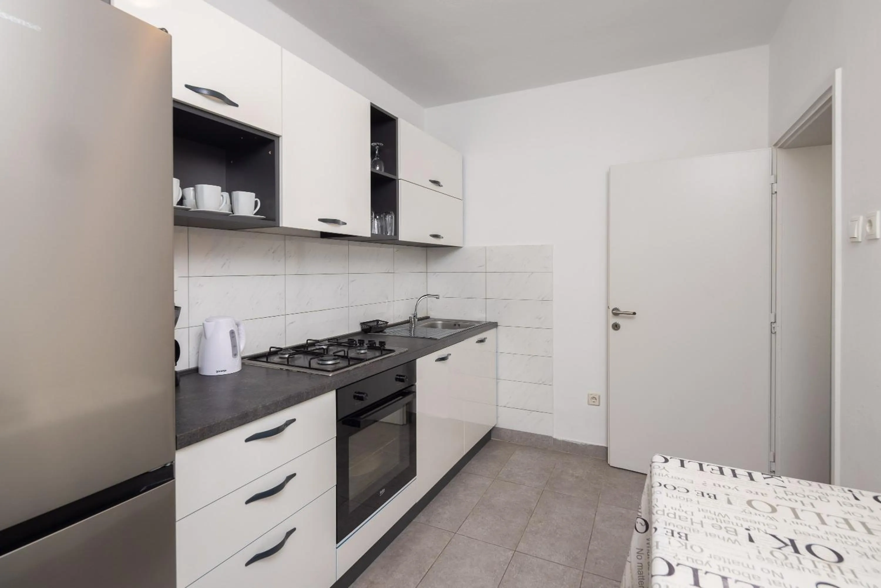 dishwasher in Seaside Apartment Blue
