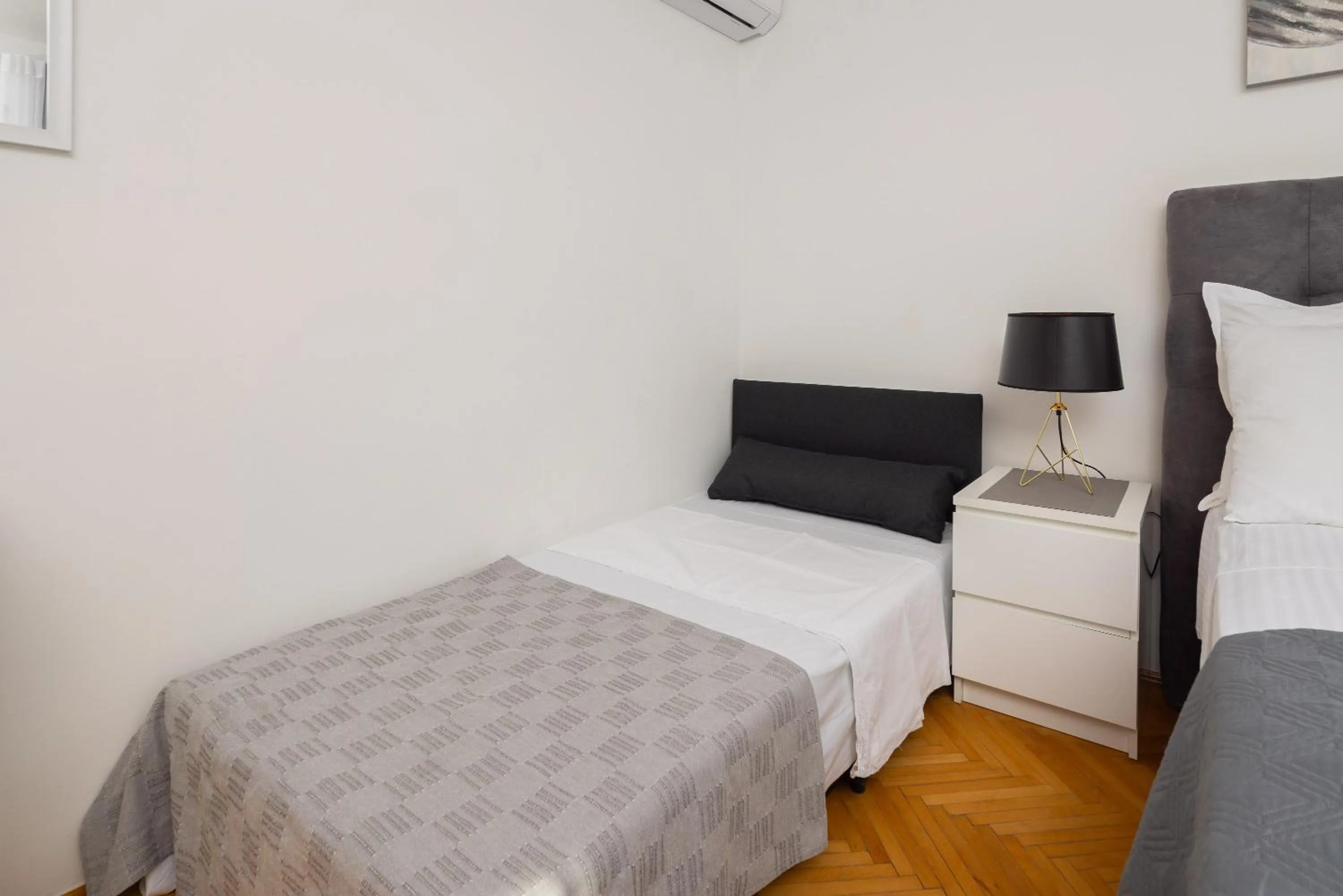 Bed in Seaside Apartment Blue