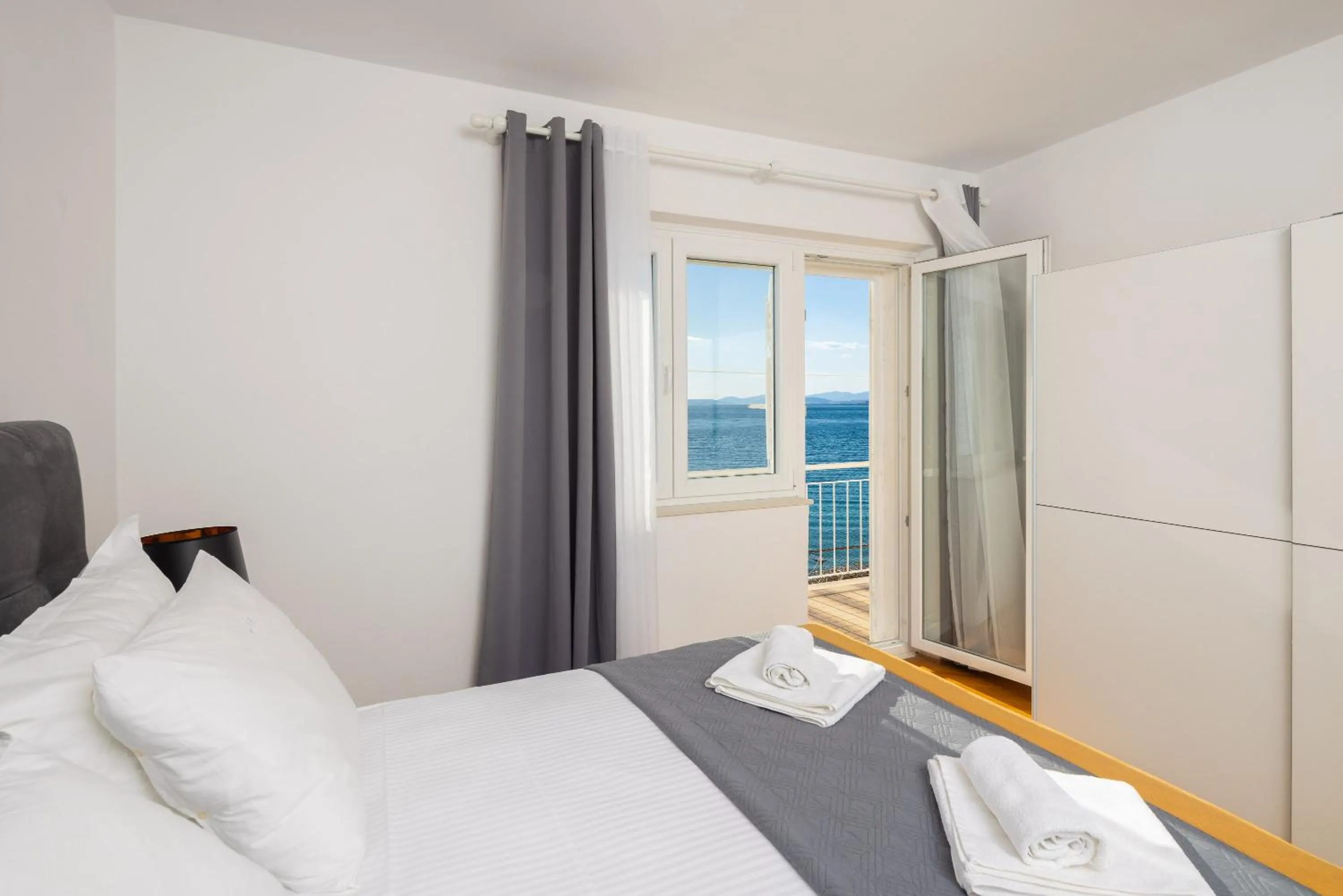 Bed in Seaside Apartment Blue