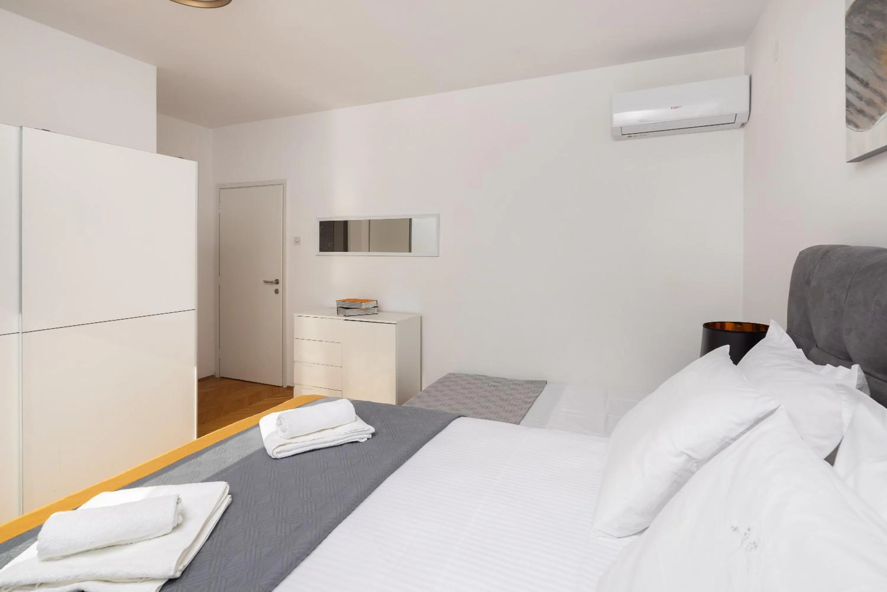 towels, Bed in Seaside Apartment Blue