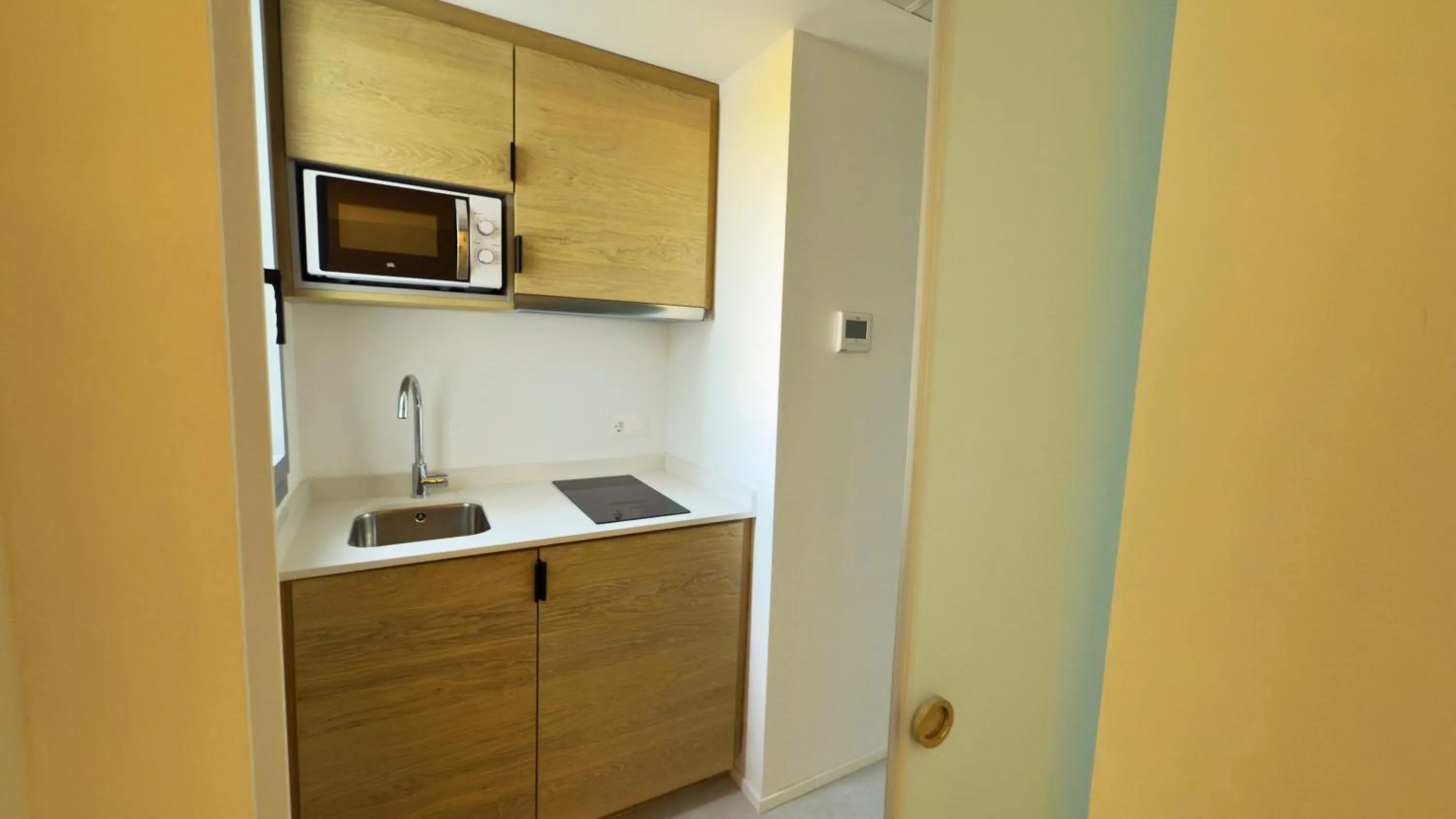Kitchen or kitchenette in MYO Barcelona Hotel & Apartments