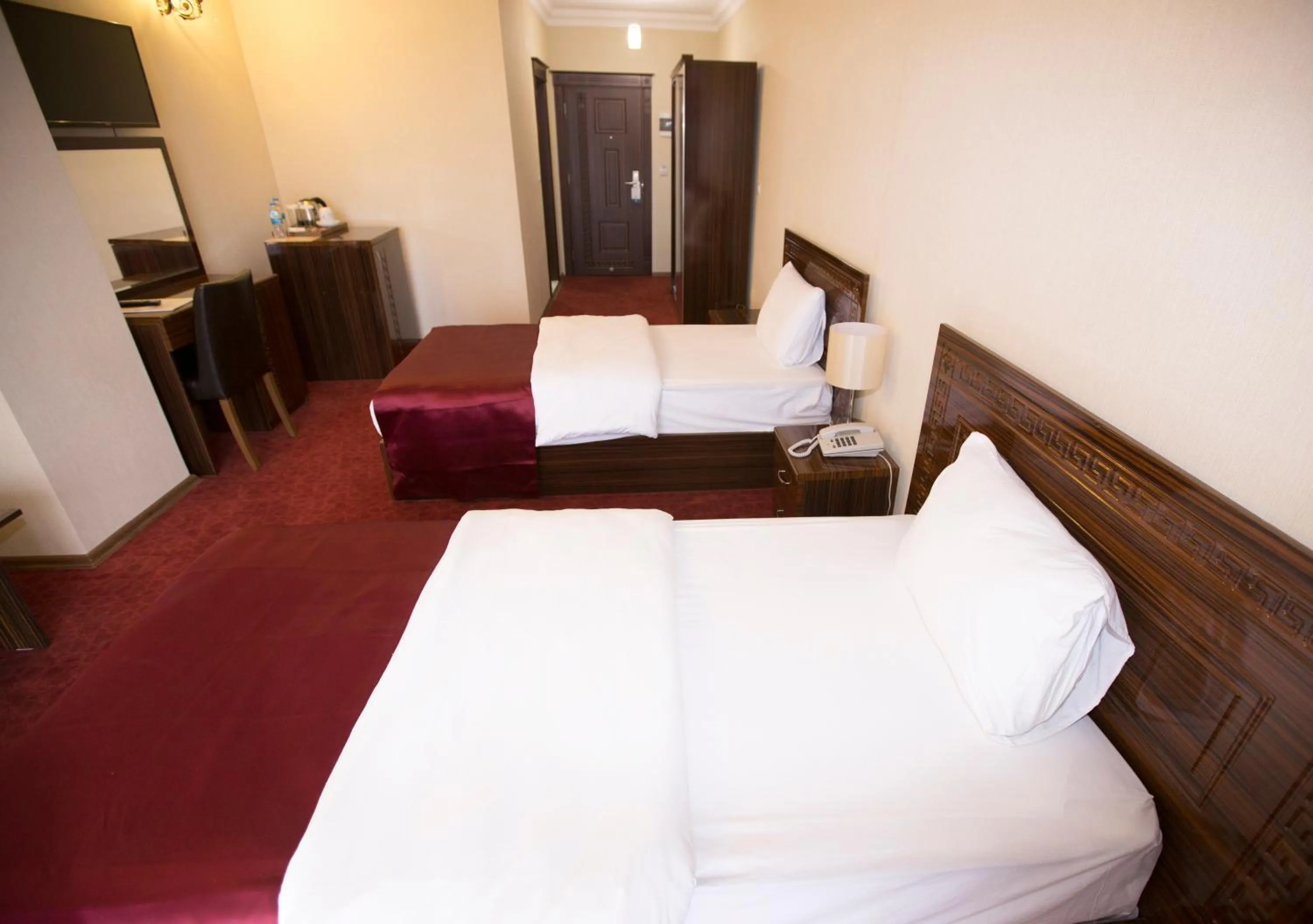 Bed in Resmina Hotel