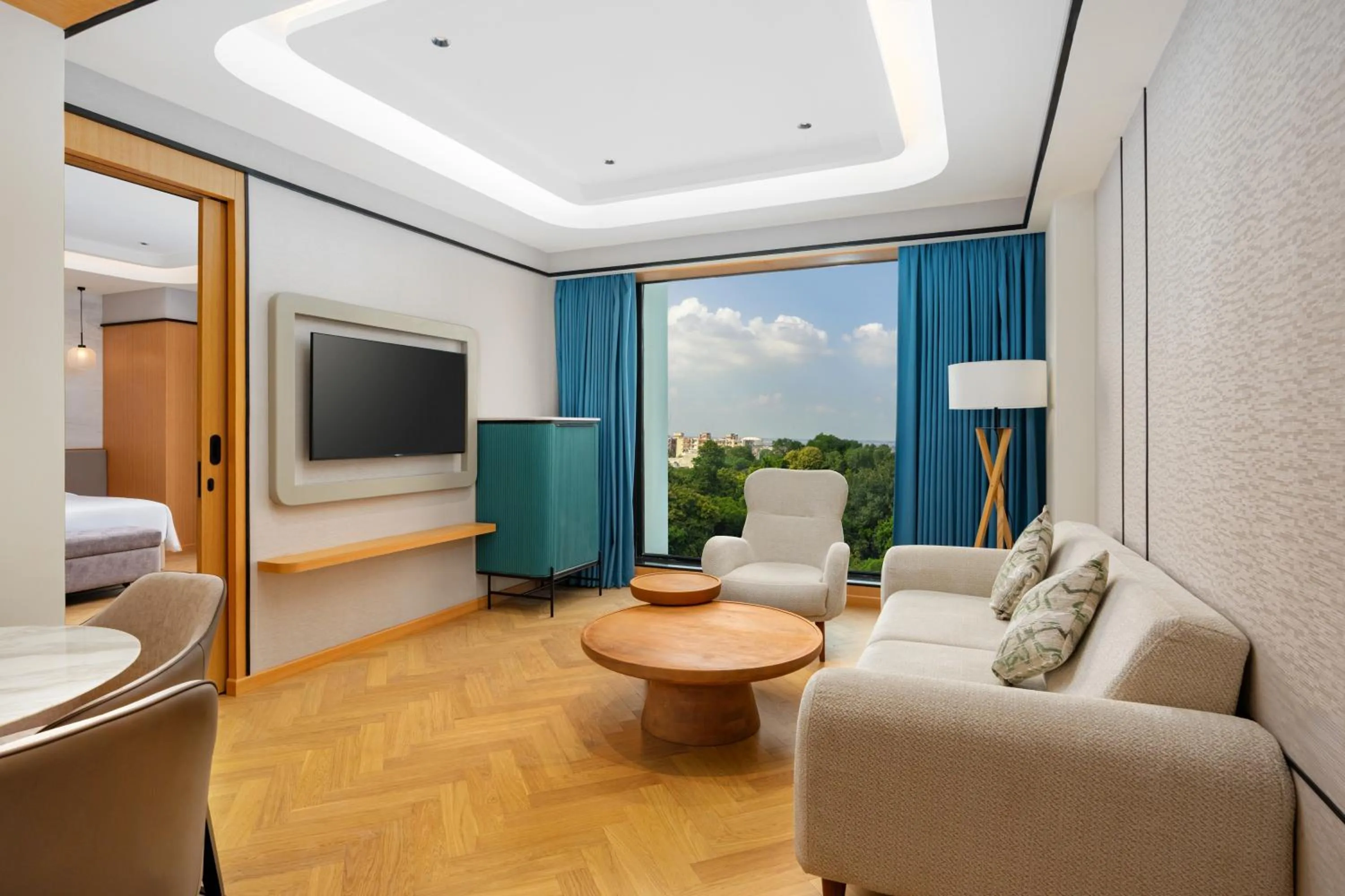 Living room, Bed in Radisson Hotel Prayagraj