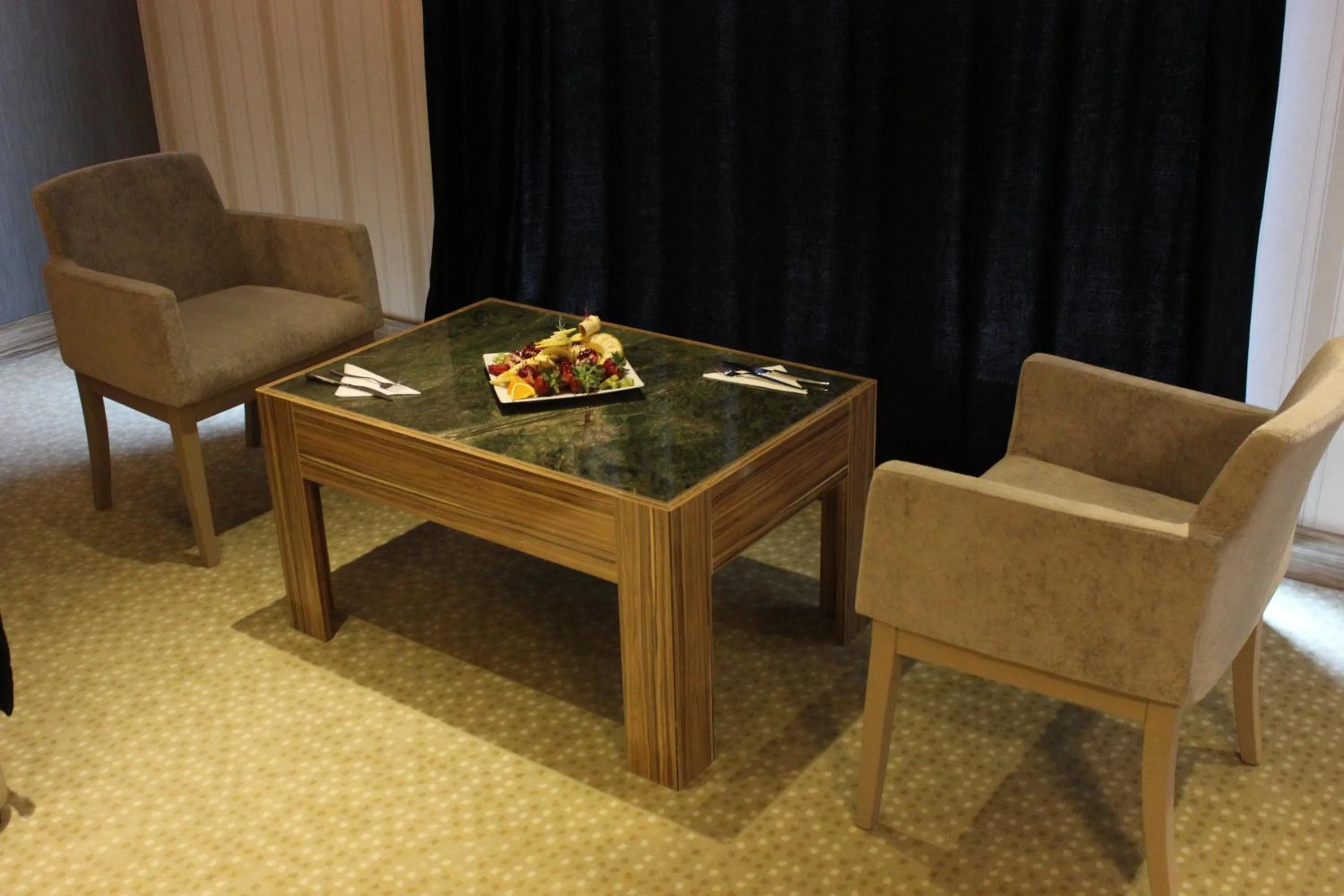 Seating area in Neba Royal Hotel