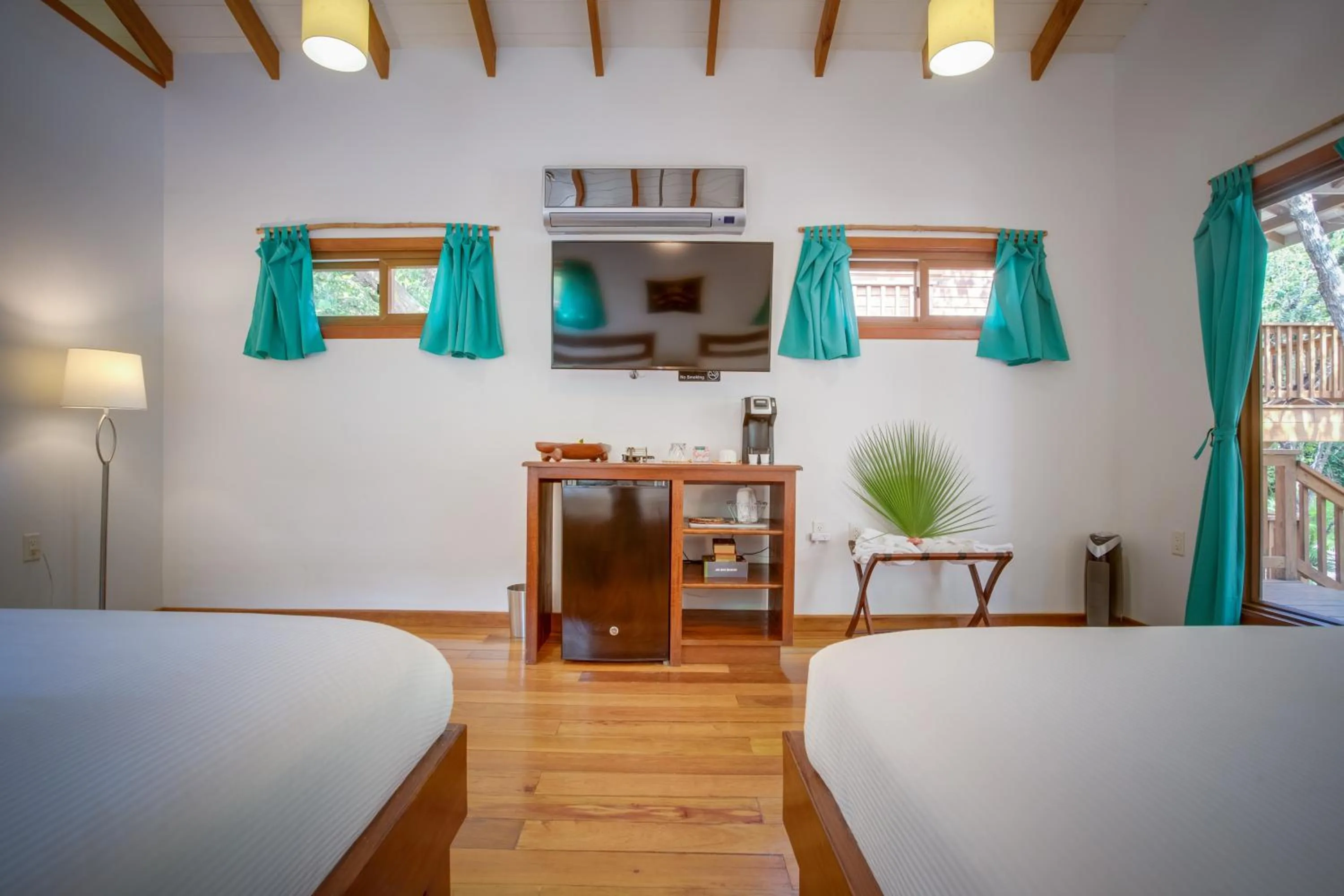 Bed in Mariposa Belize Beach Resort