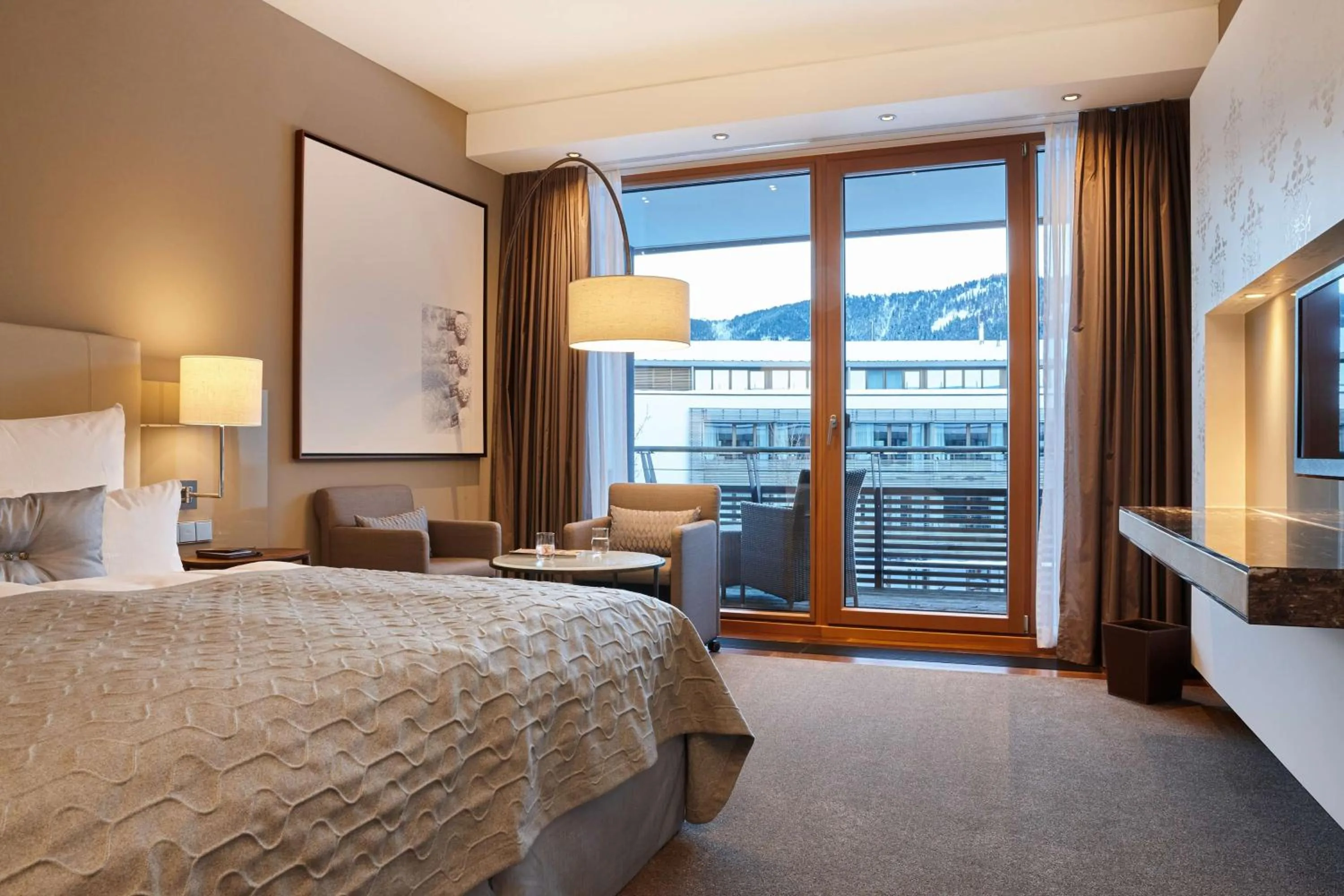 Living room, Bed in Kempinski Hotel Berchtesgaden