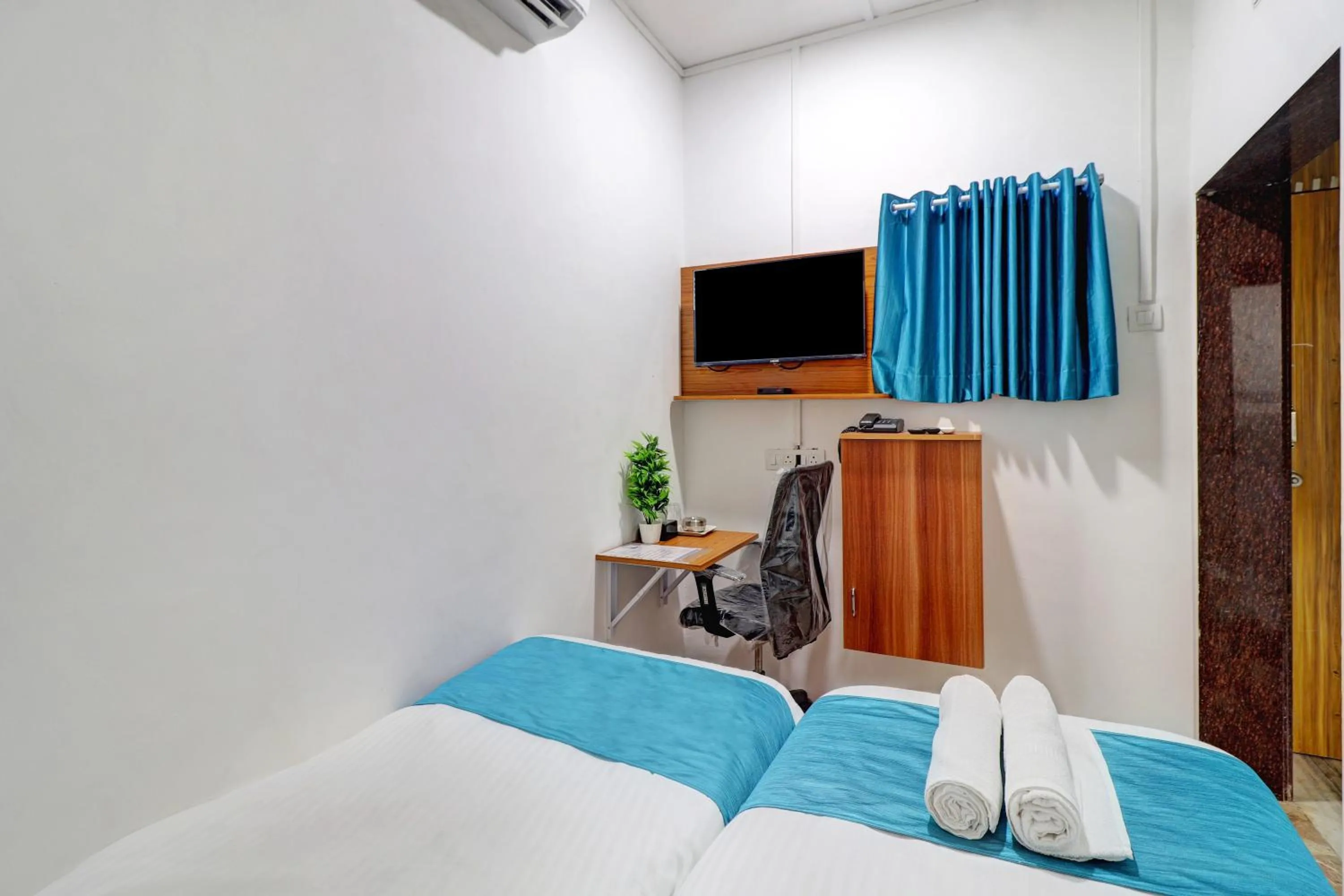 Bed in Raksha Residency