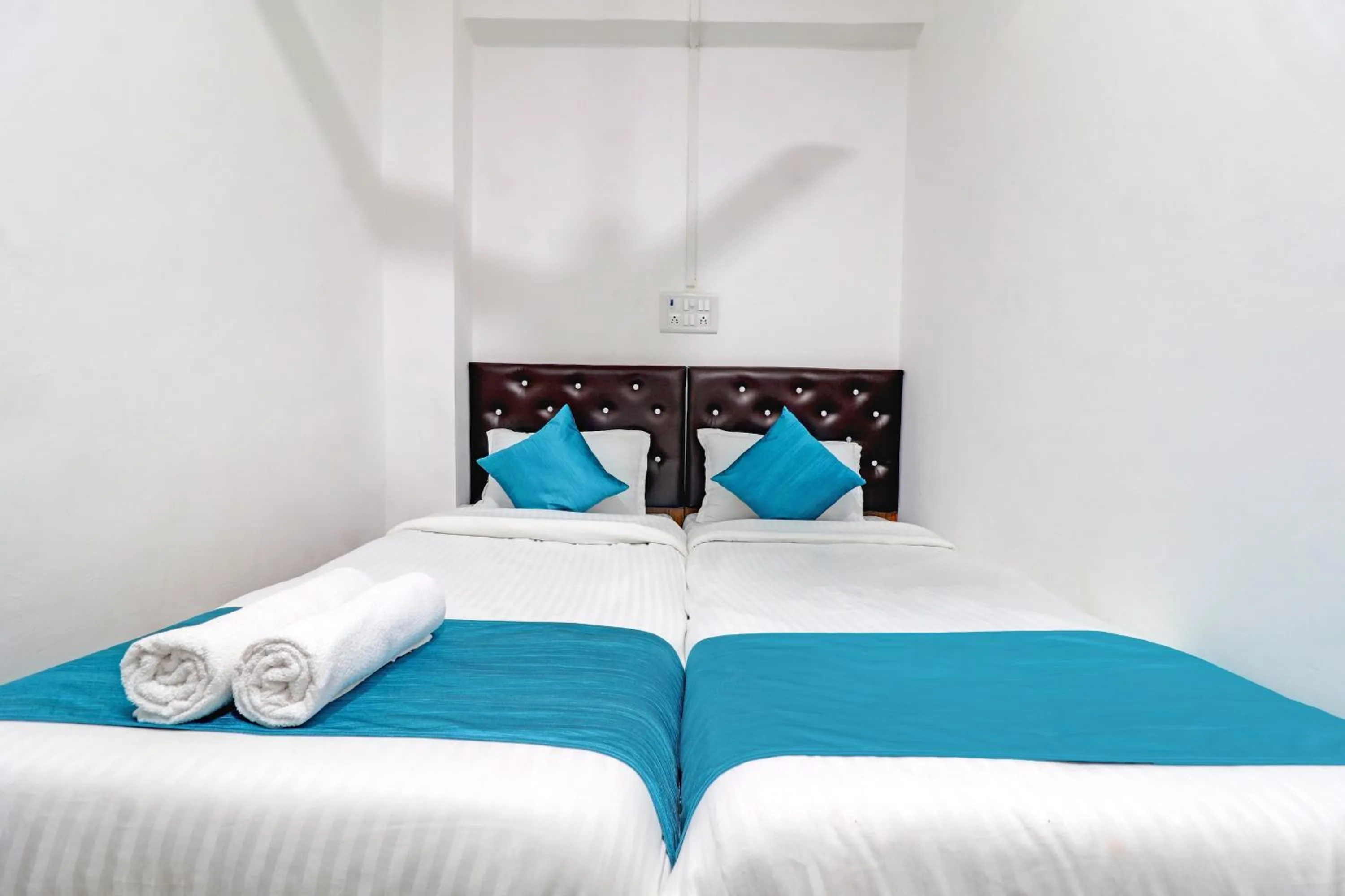 Bed in Raksha Residency