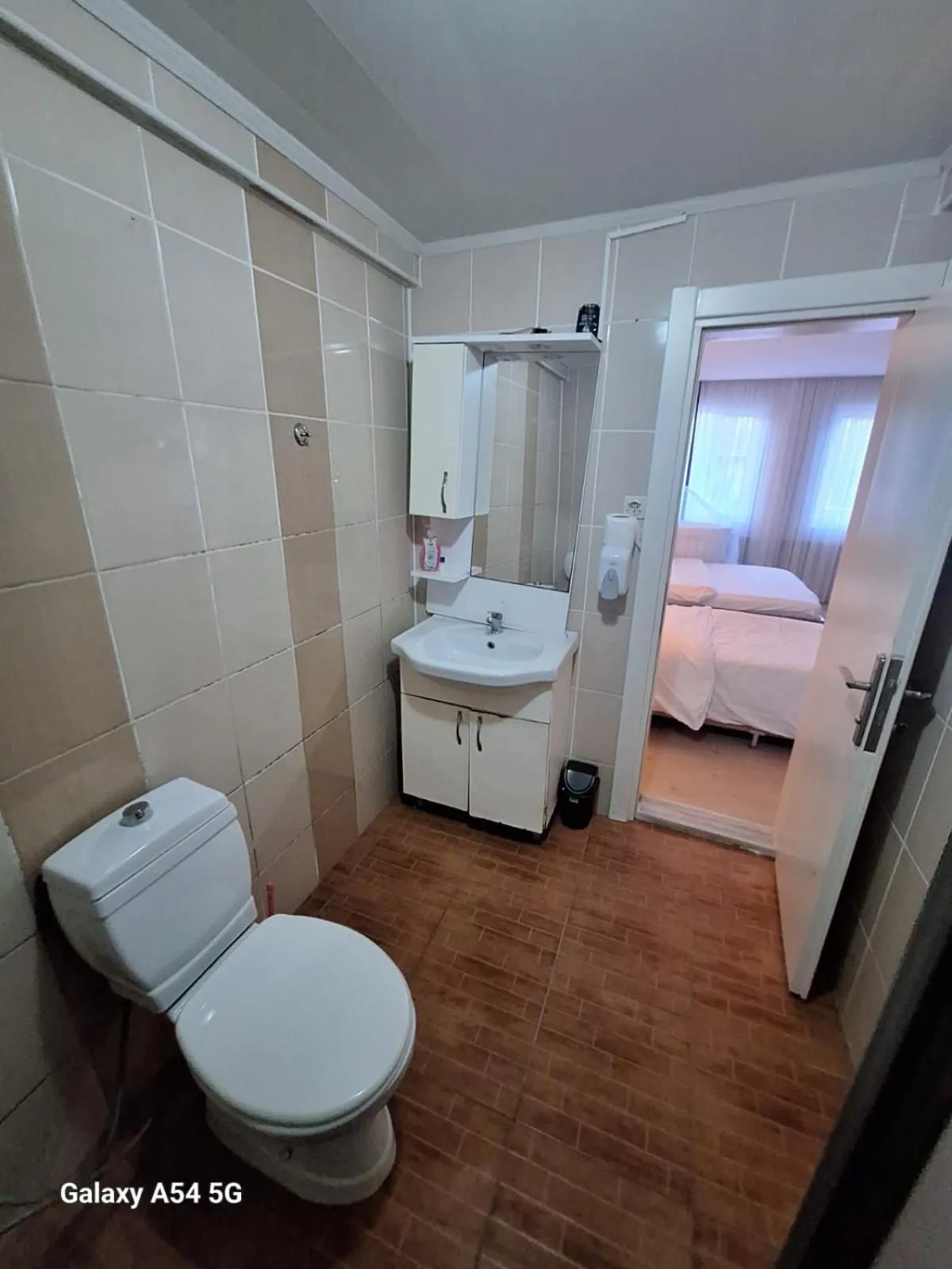 Toilet, Bed in Dilmac Hotel