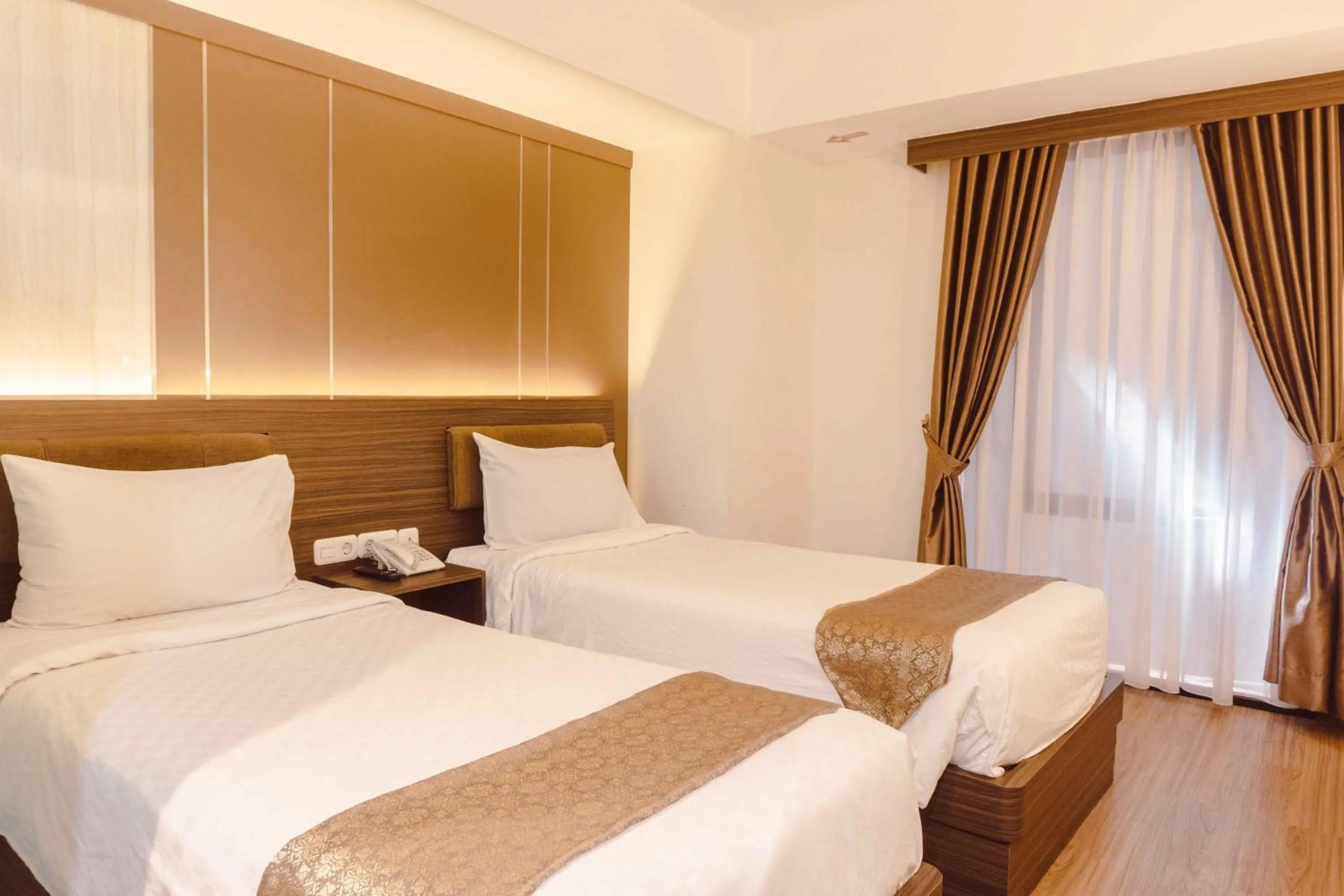 Bed in Fahira Hotel Syariah Bukittinggi