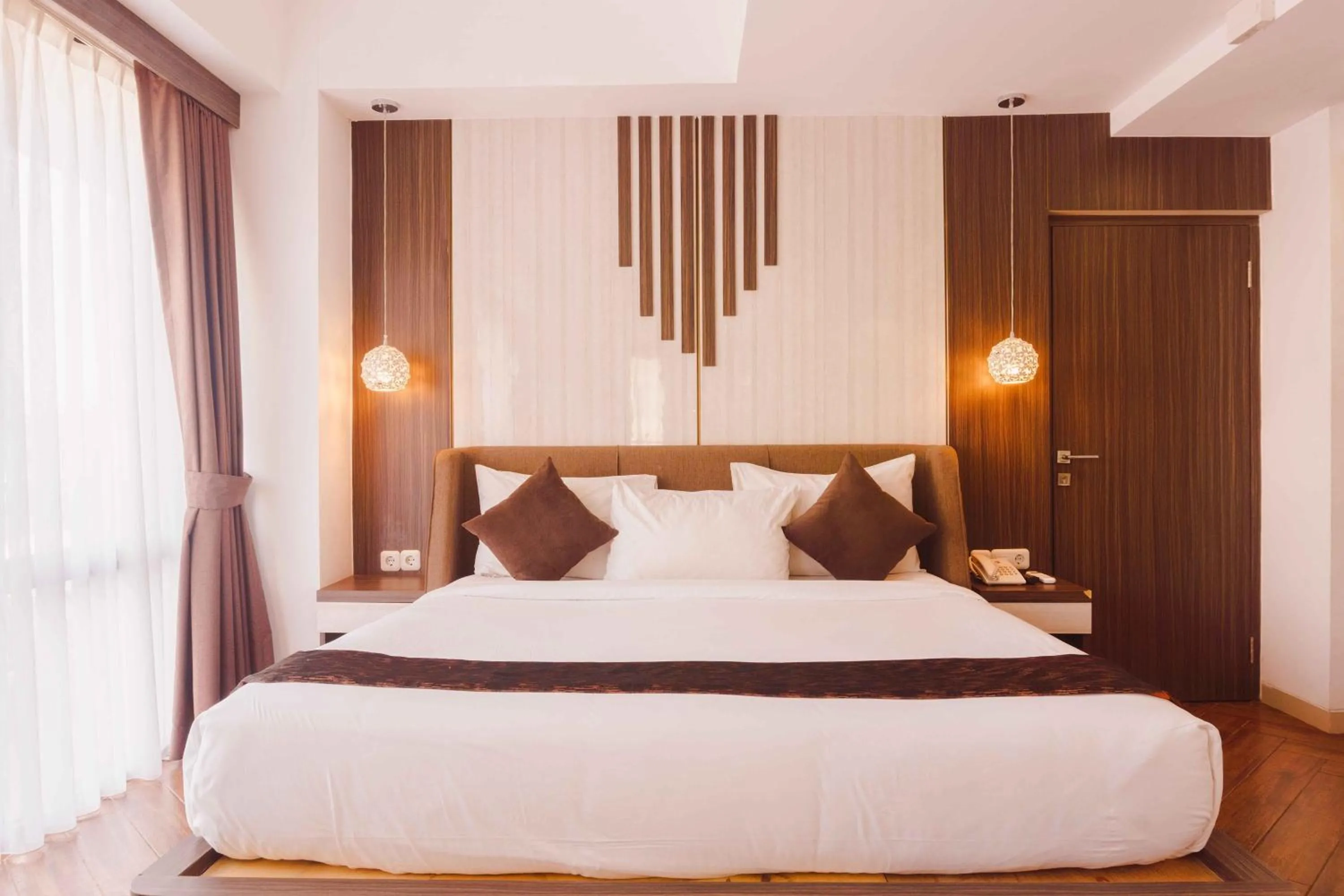 Bed in Fahira Hotel Syariah Bukittinggi