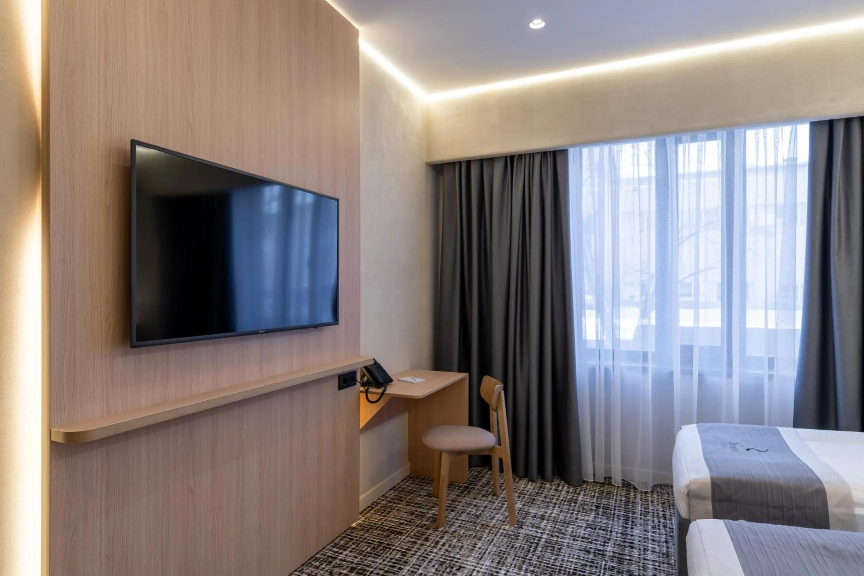 TV and multimedia, Bed in Renion City Hotel