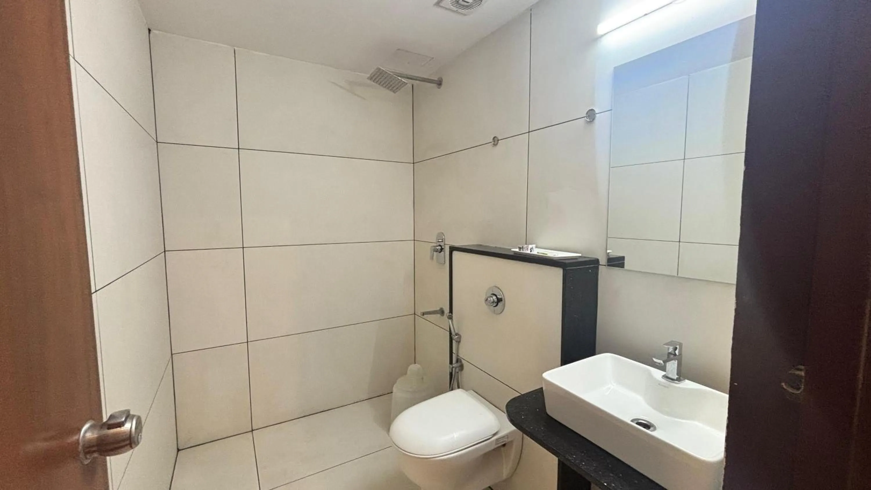 Shower in Hotel Kalyan Suites