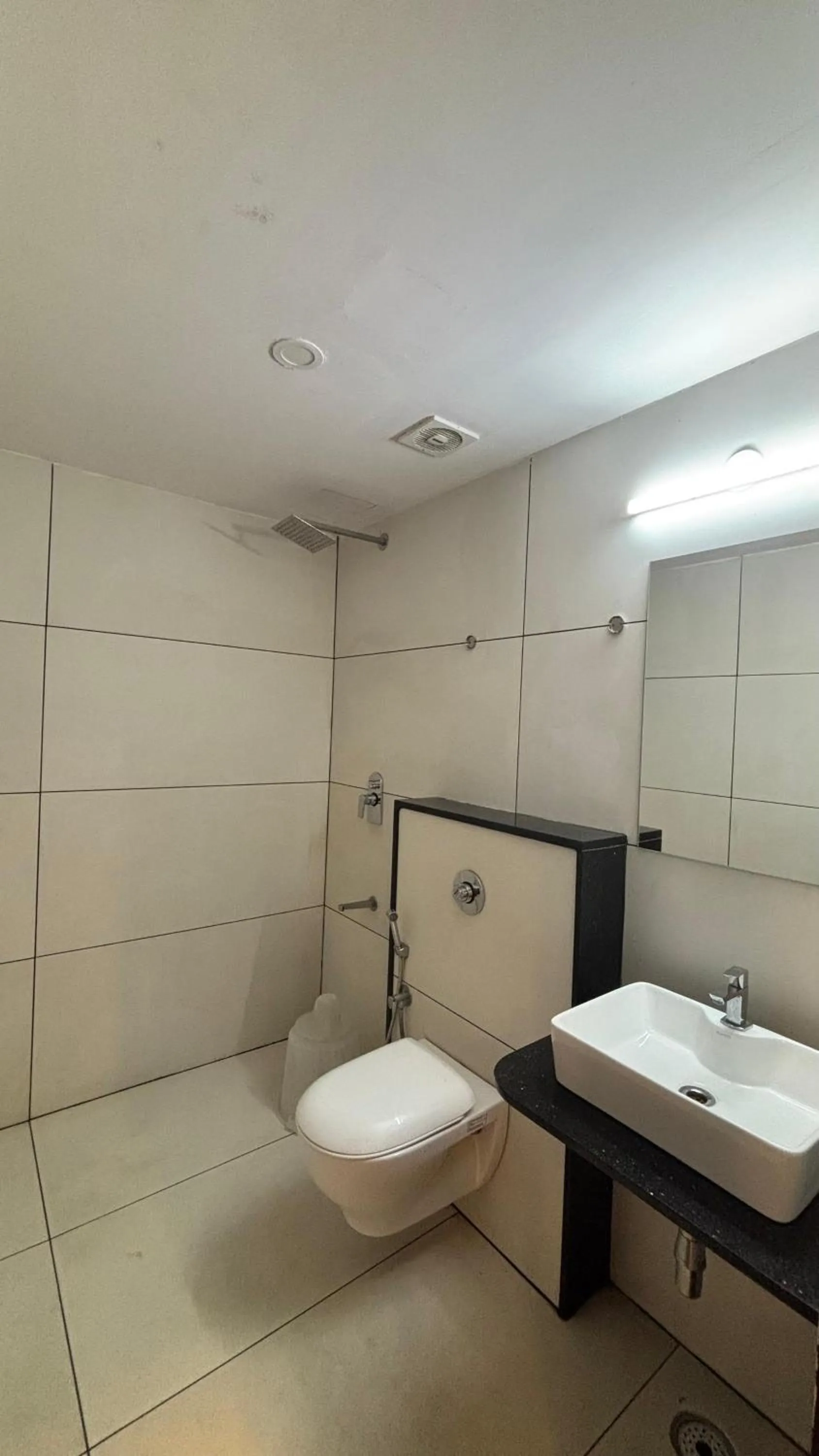 Shower in Hotel Kalyan Suites