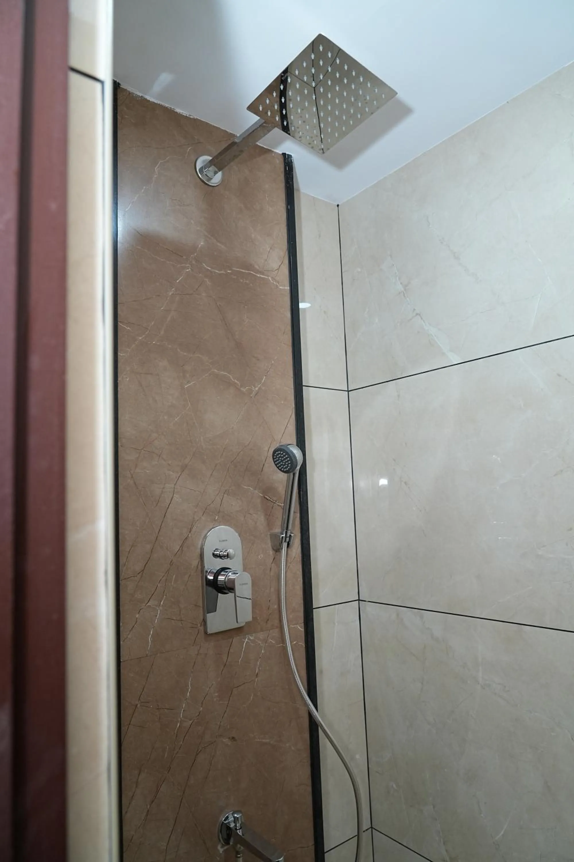 Shower in Hotel Kalyan Suites