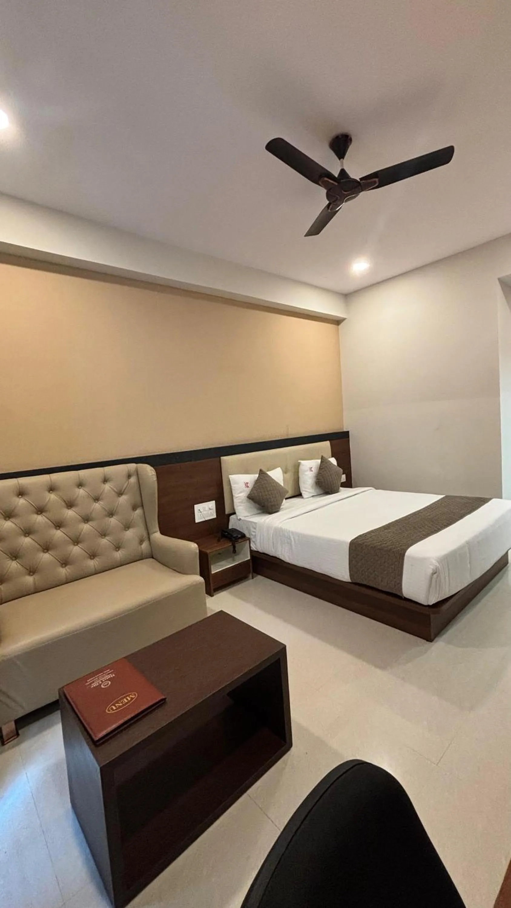 Bed in Hotel Kalyan Suites