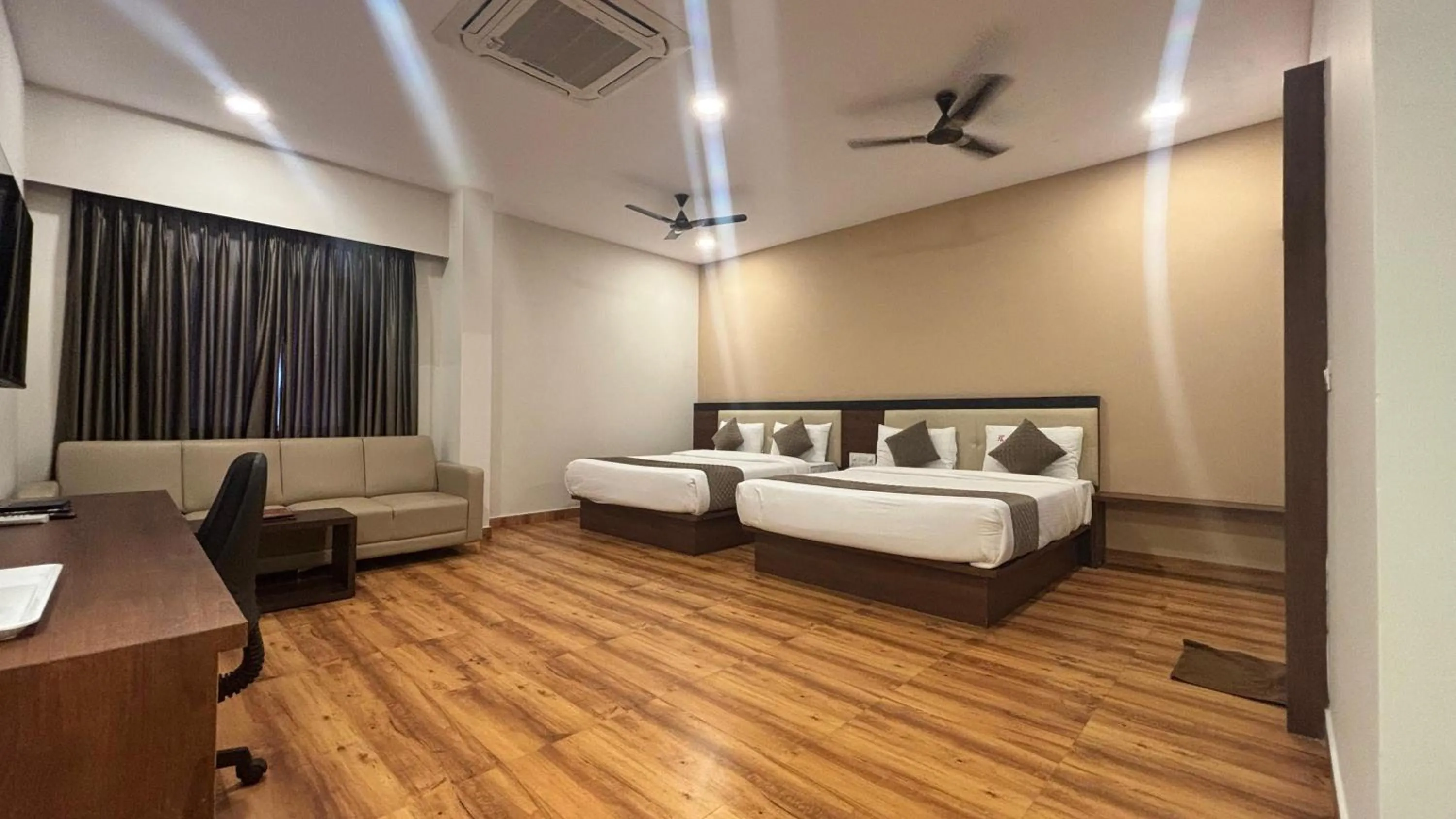 Bed in Hotel Kalyan Suites