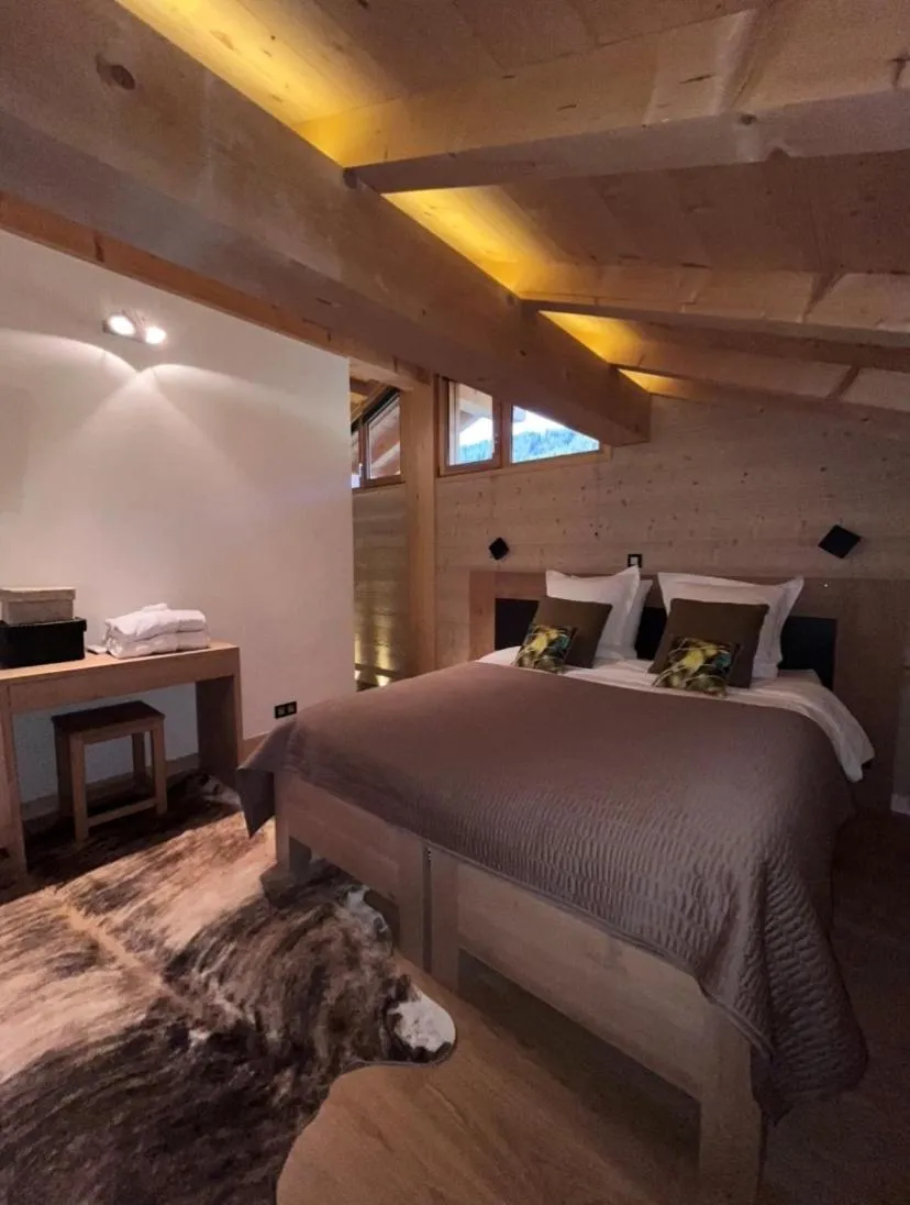 Bed in Chalet Inarpa - Appartements et Suites