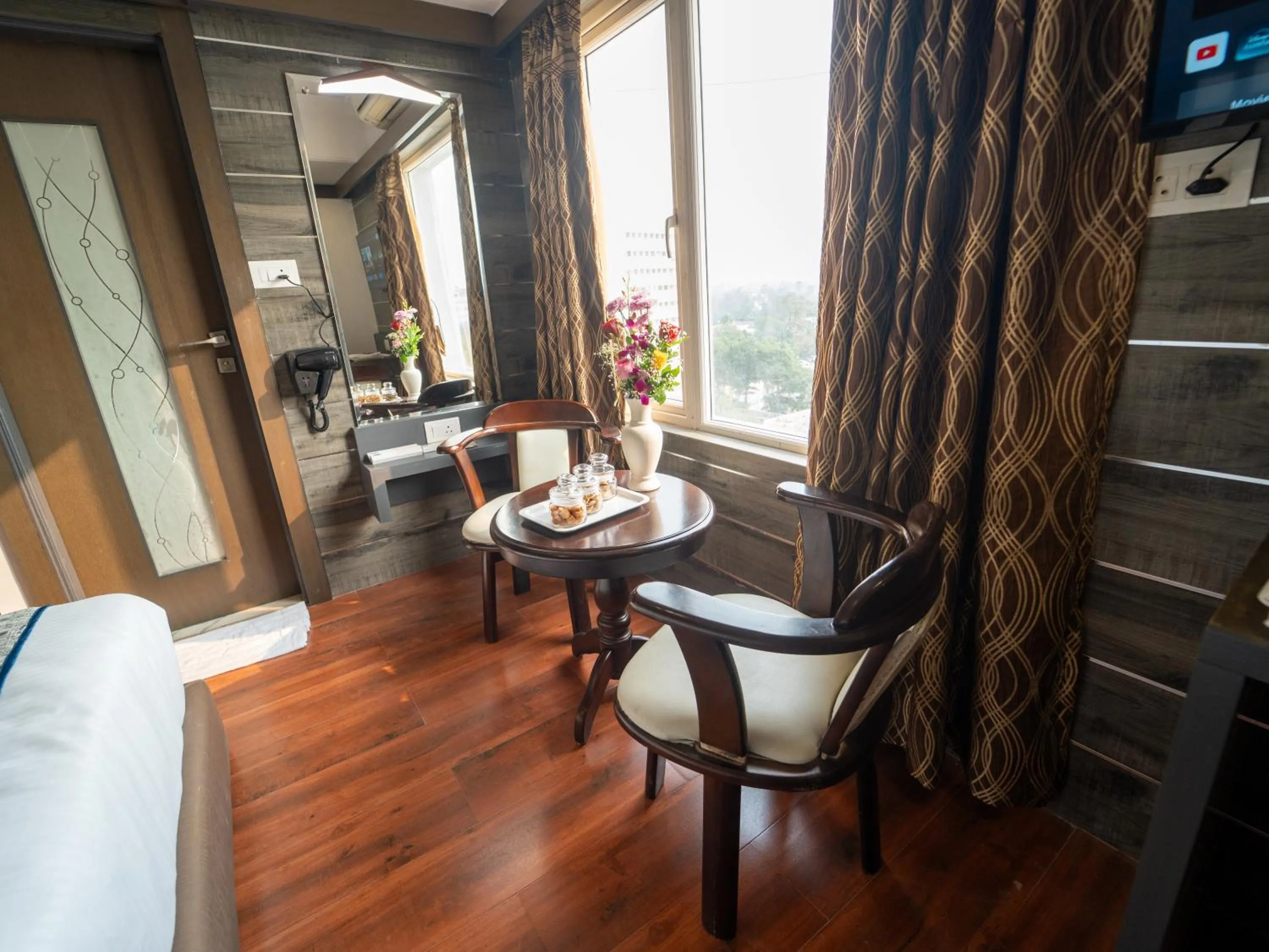 Seating area in Hotel Pravasa Stay