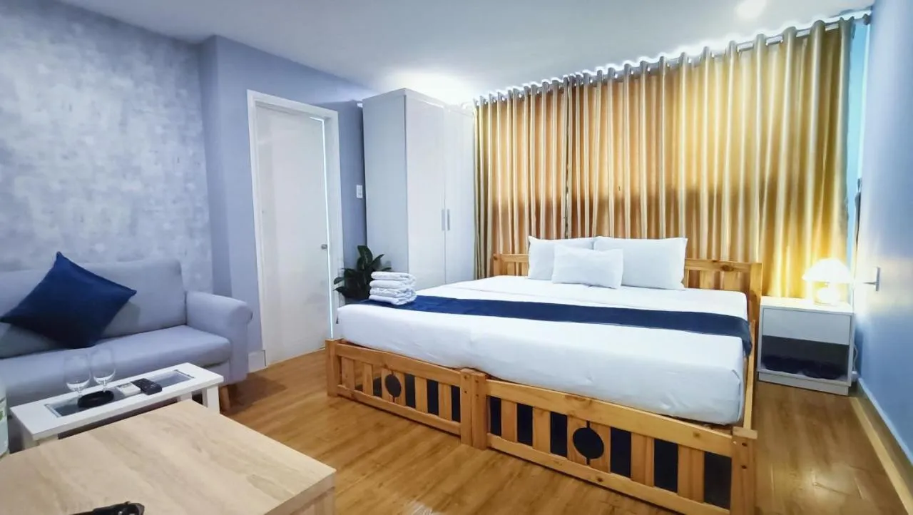 Bed in Queen Central Apartment Hotel