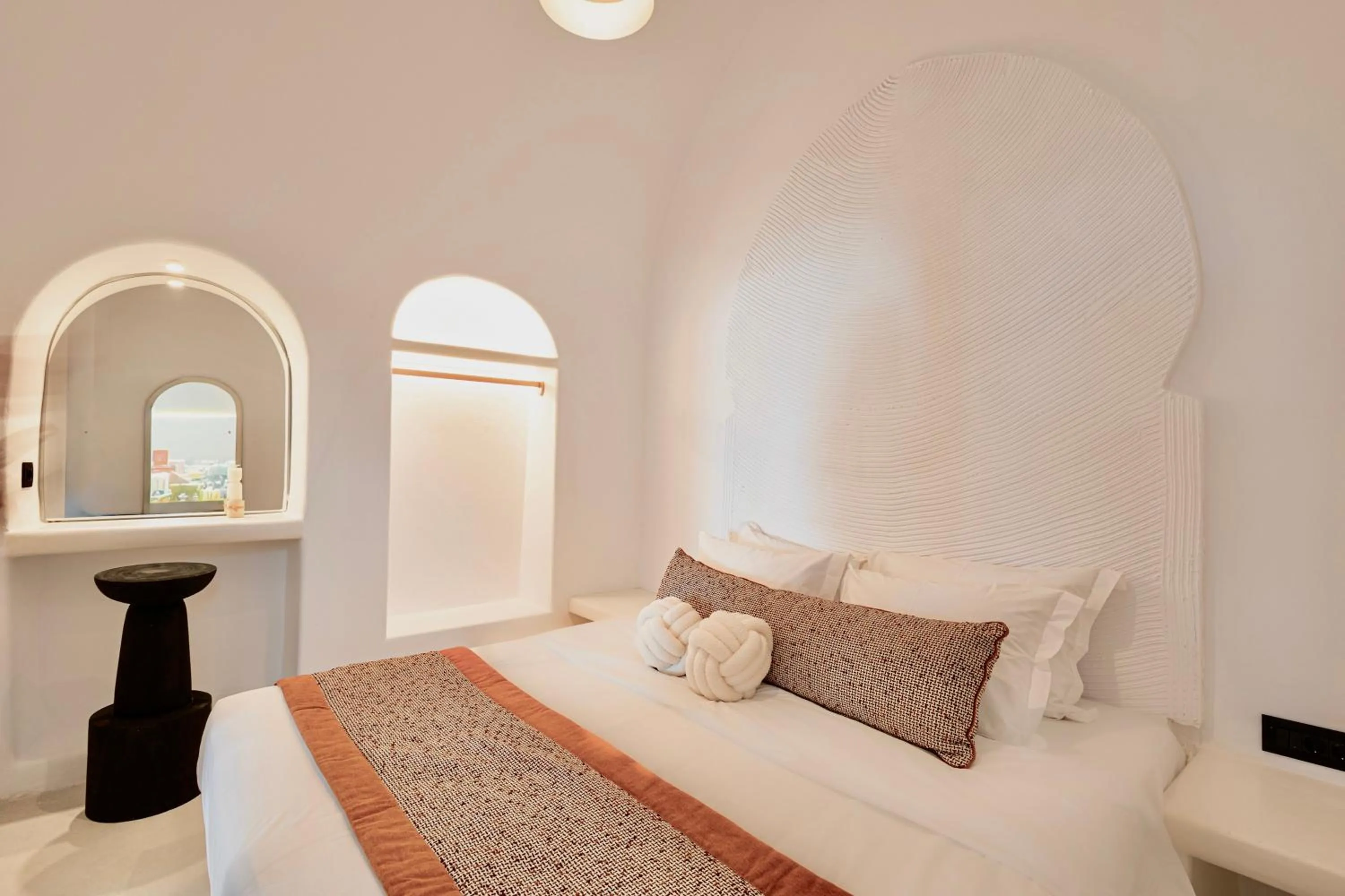 Bed in Luna Santorini Suites