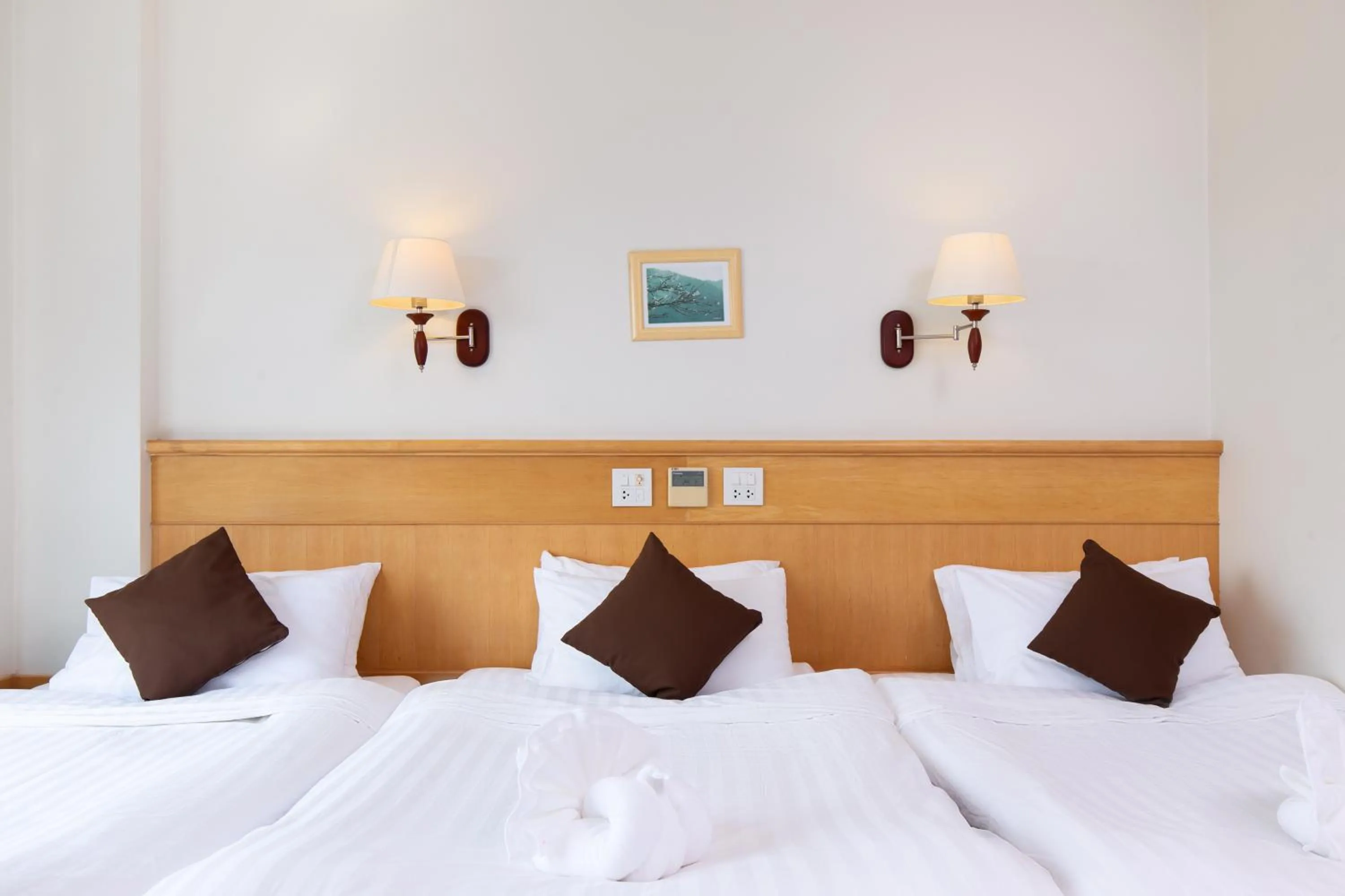 Bed in Kanchanaburi City Hotel