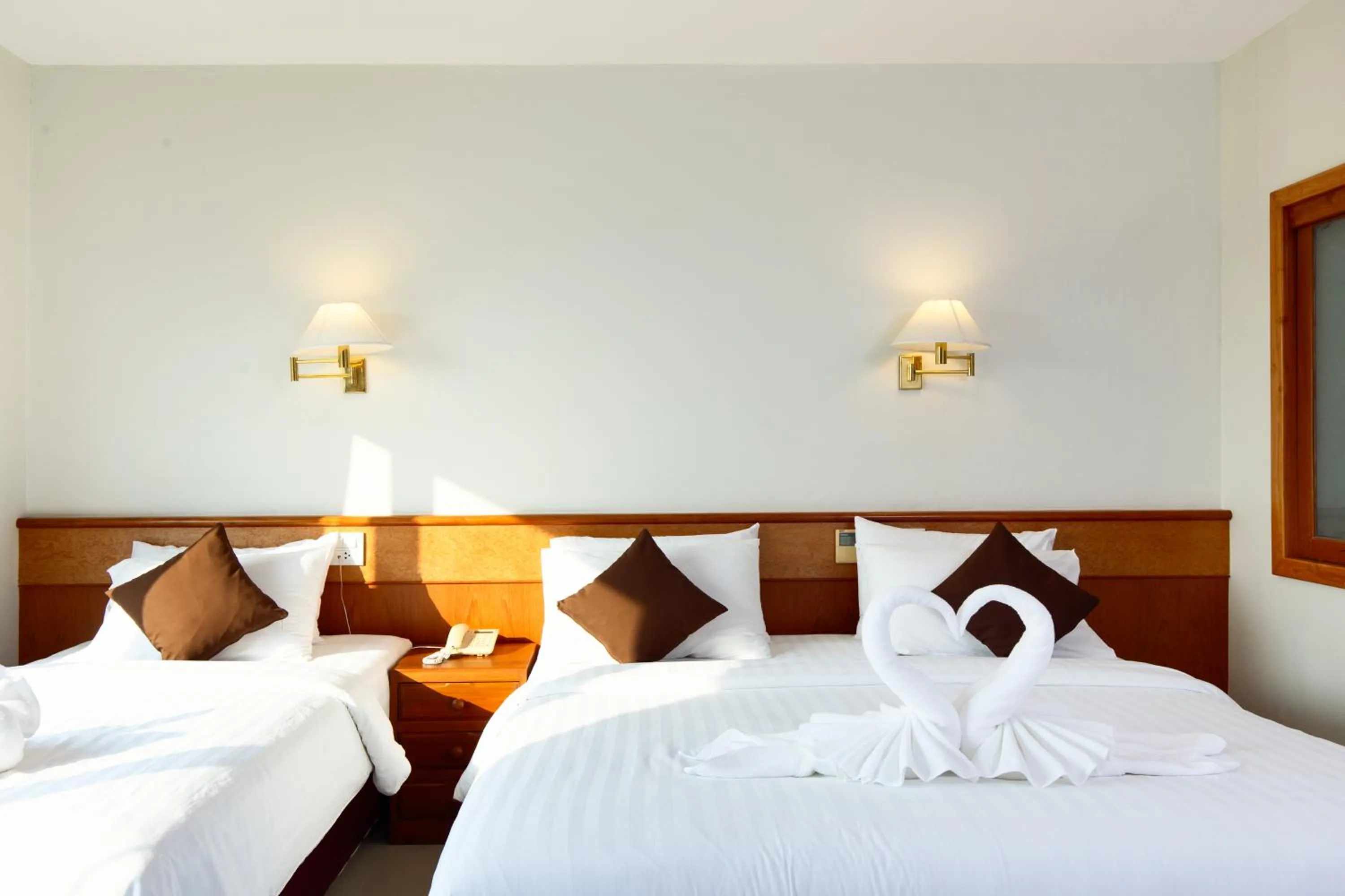 Bed in Kanchanaburi City Hotel