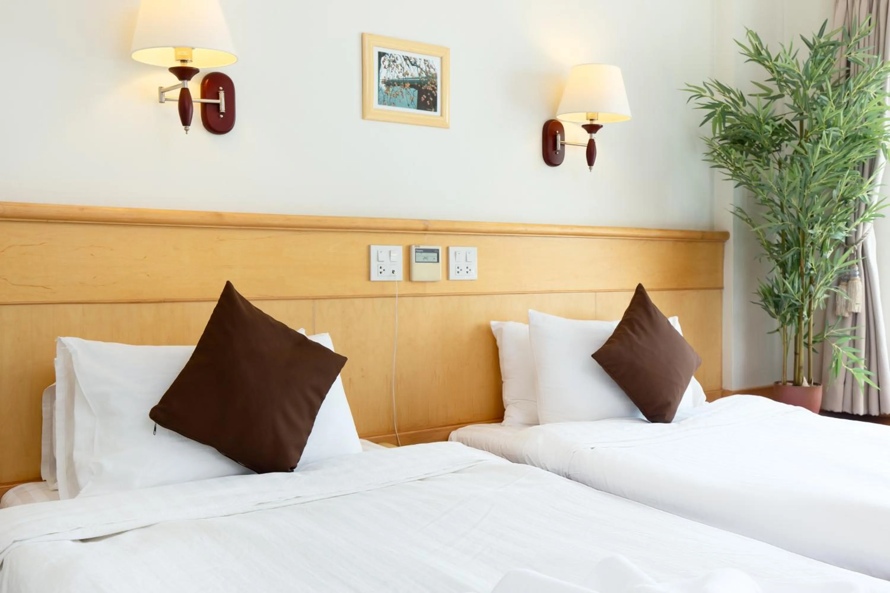 Bed in Kanchanaburi City Hotel