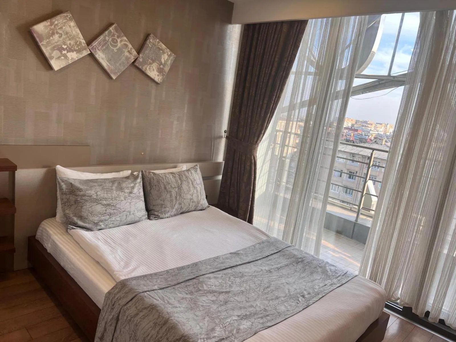 Bed in Liv Suit Hotel