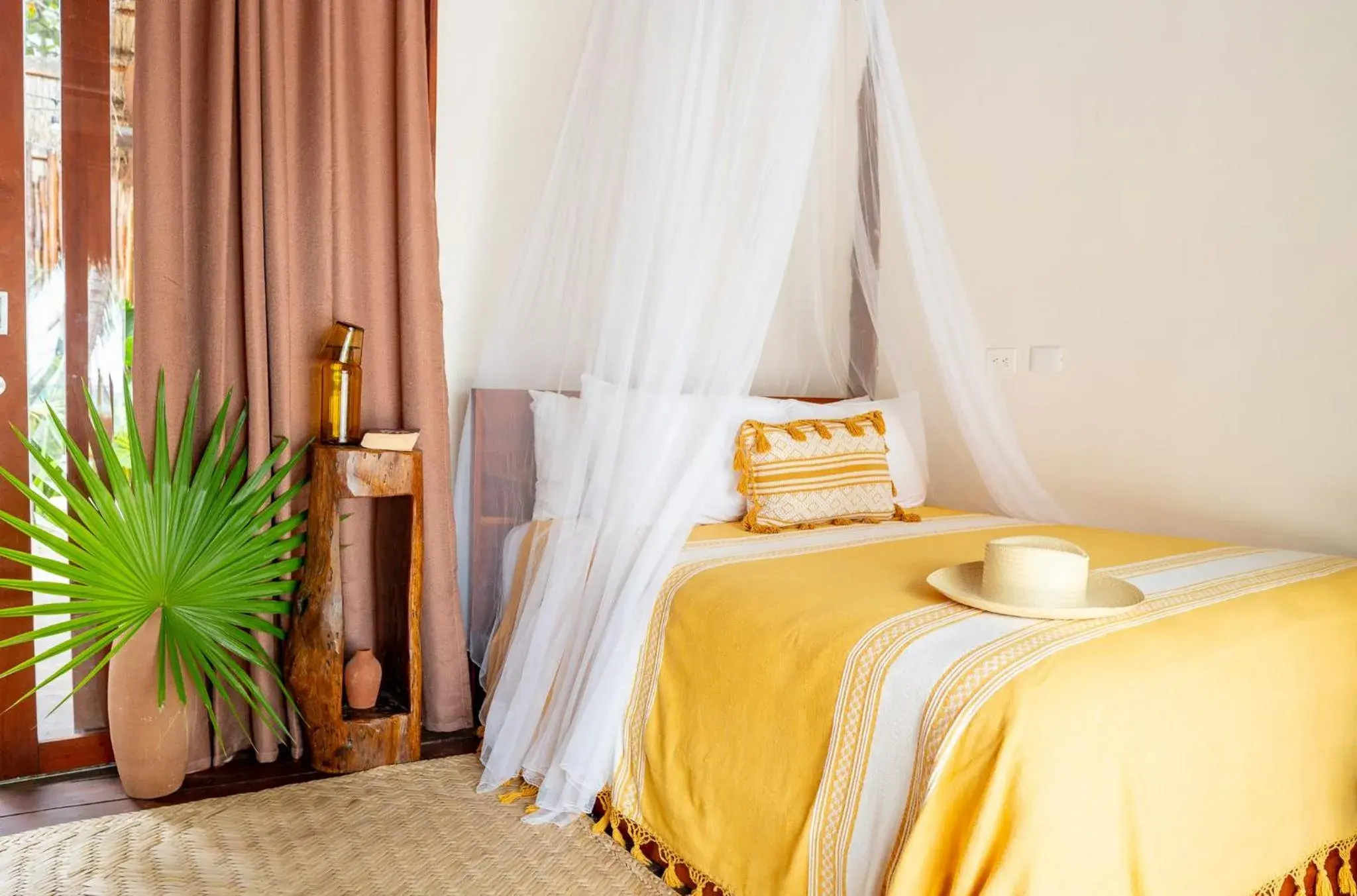 Bed in La Zebra Tulum, a Small Luxury Hotel Bed in La Zebra Tulum, a Small Luxury Hotel