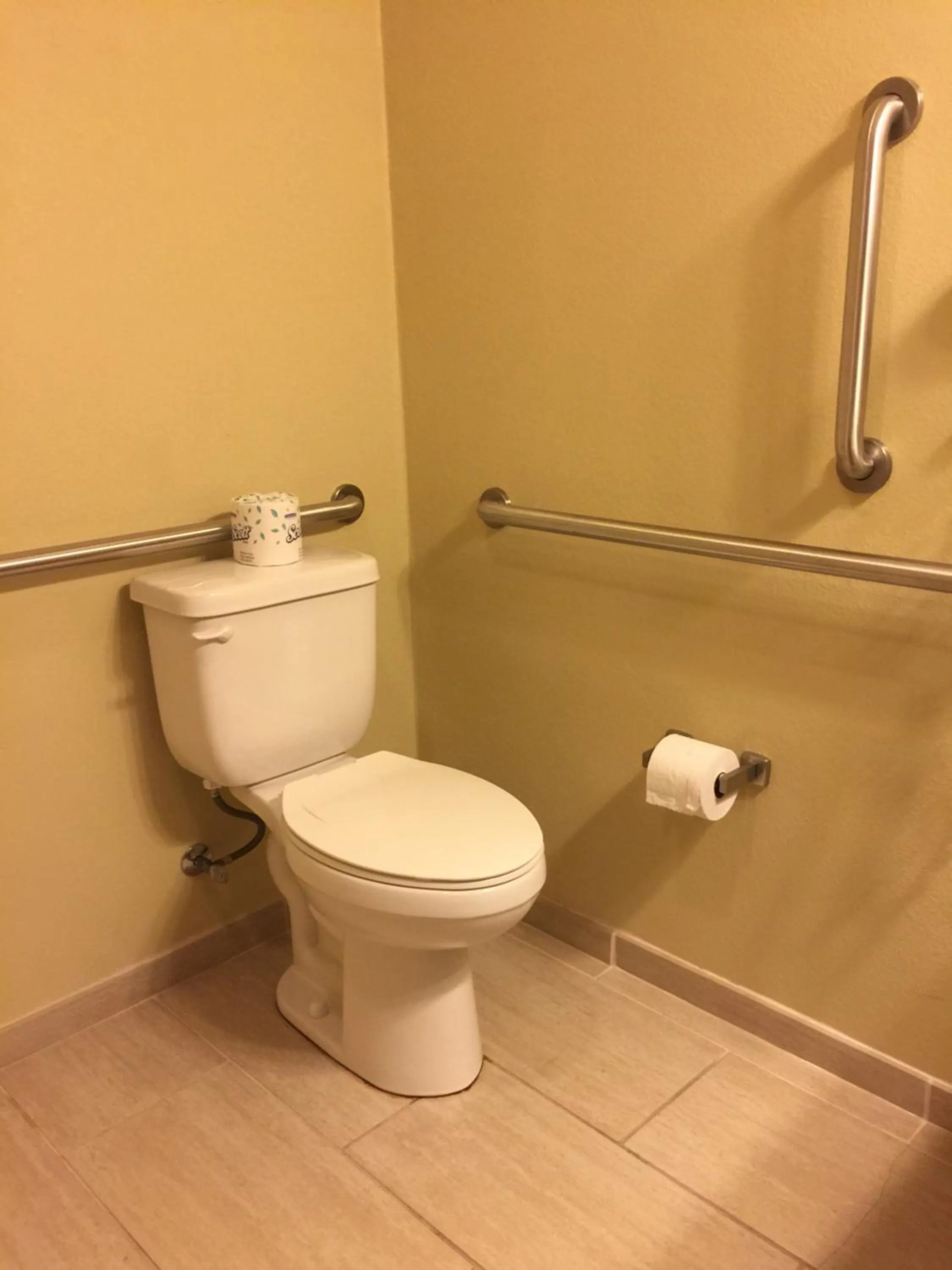 Toilet in Cobblestone Inn & Suites - Waverly