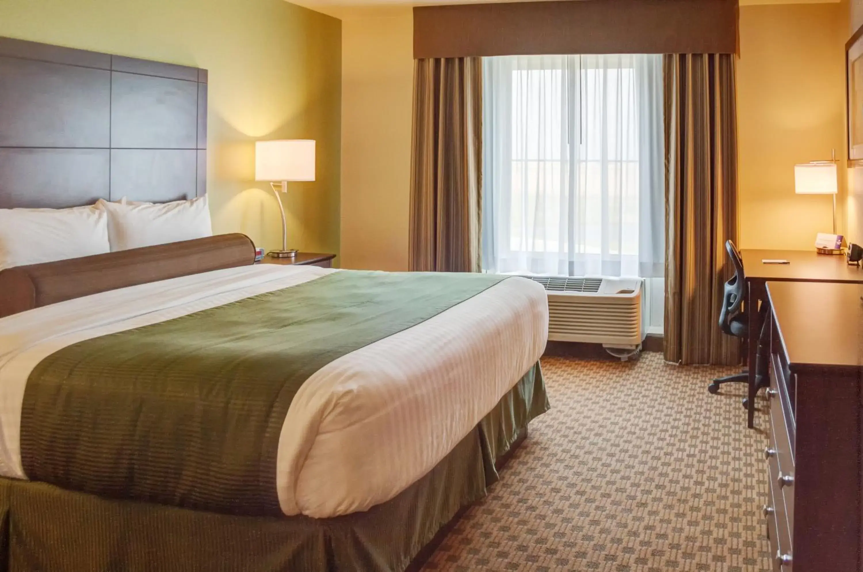 Bedroom, Bed in Cobblestone Inn & Suites - Waverly Bedroom, Bed in Cobblestone Inn & Suites - Waverly