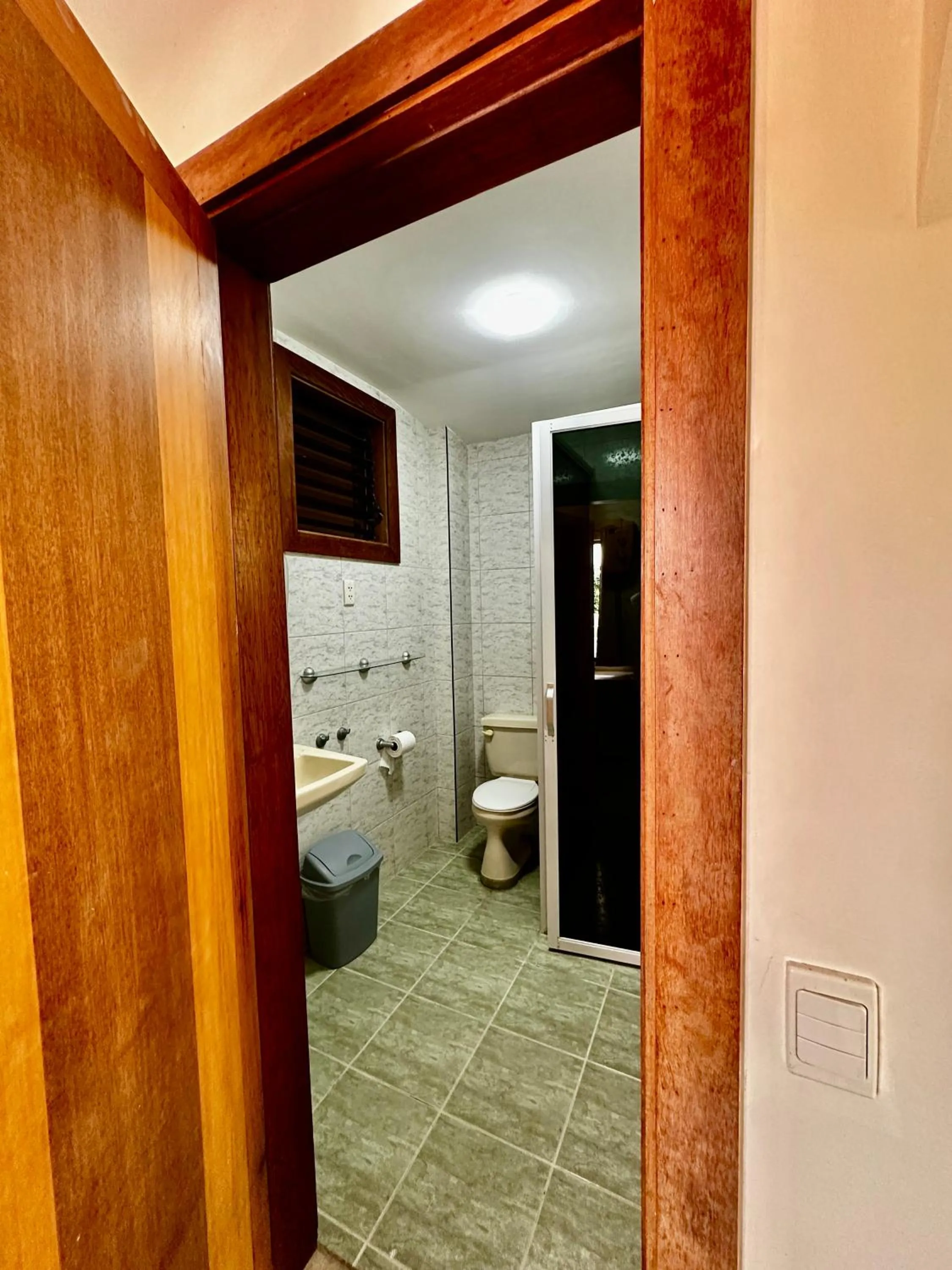 Bathroom in Bluewaves Hostel & Villa Panagsama by Hiverooms