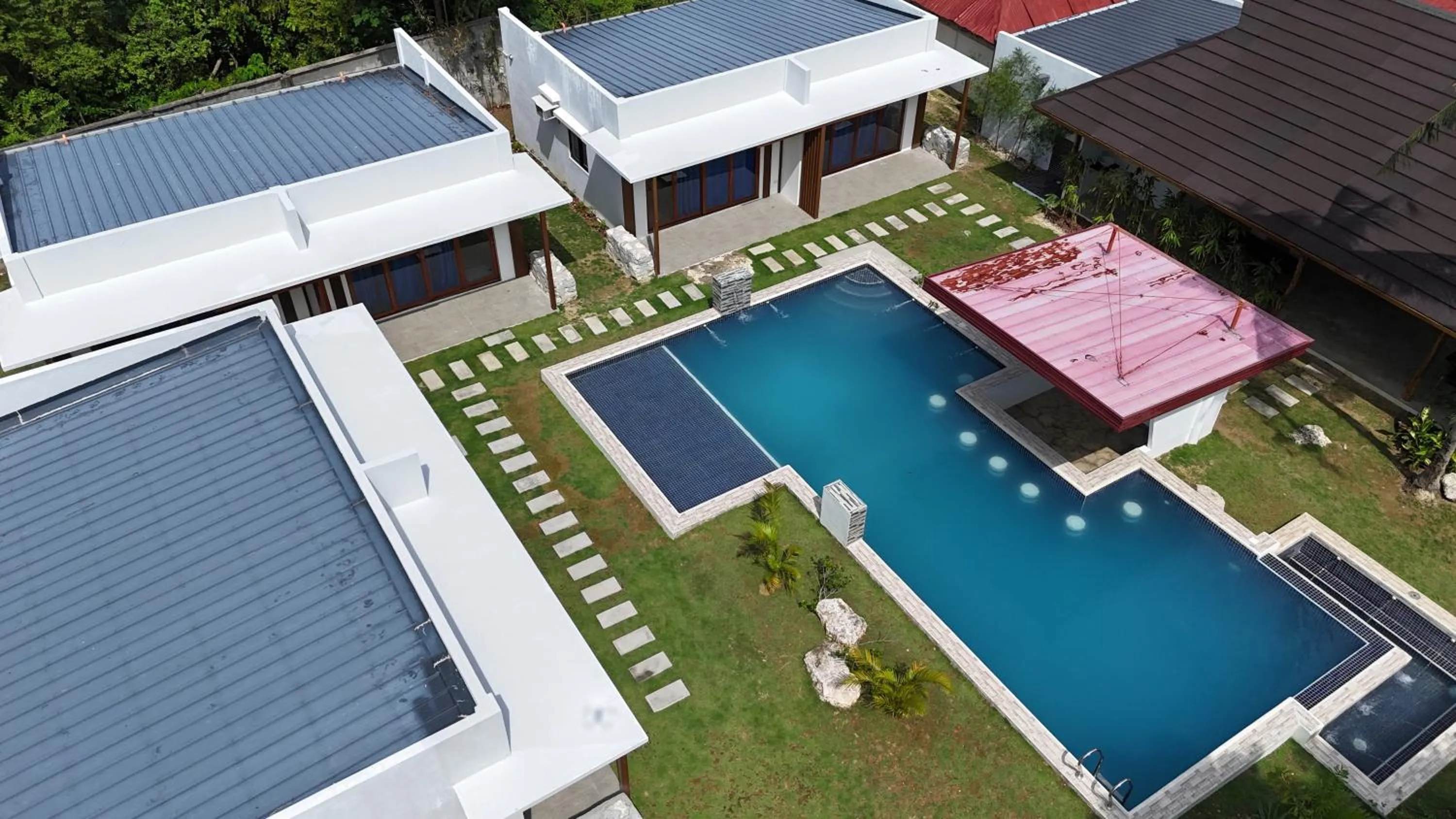 Property building in Bluewaves Hostel & Villa Panagsama by Hiverooms