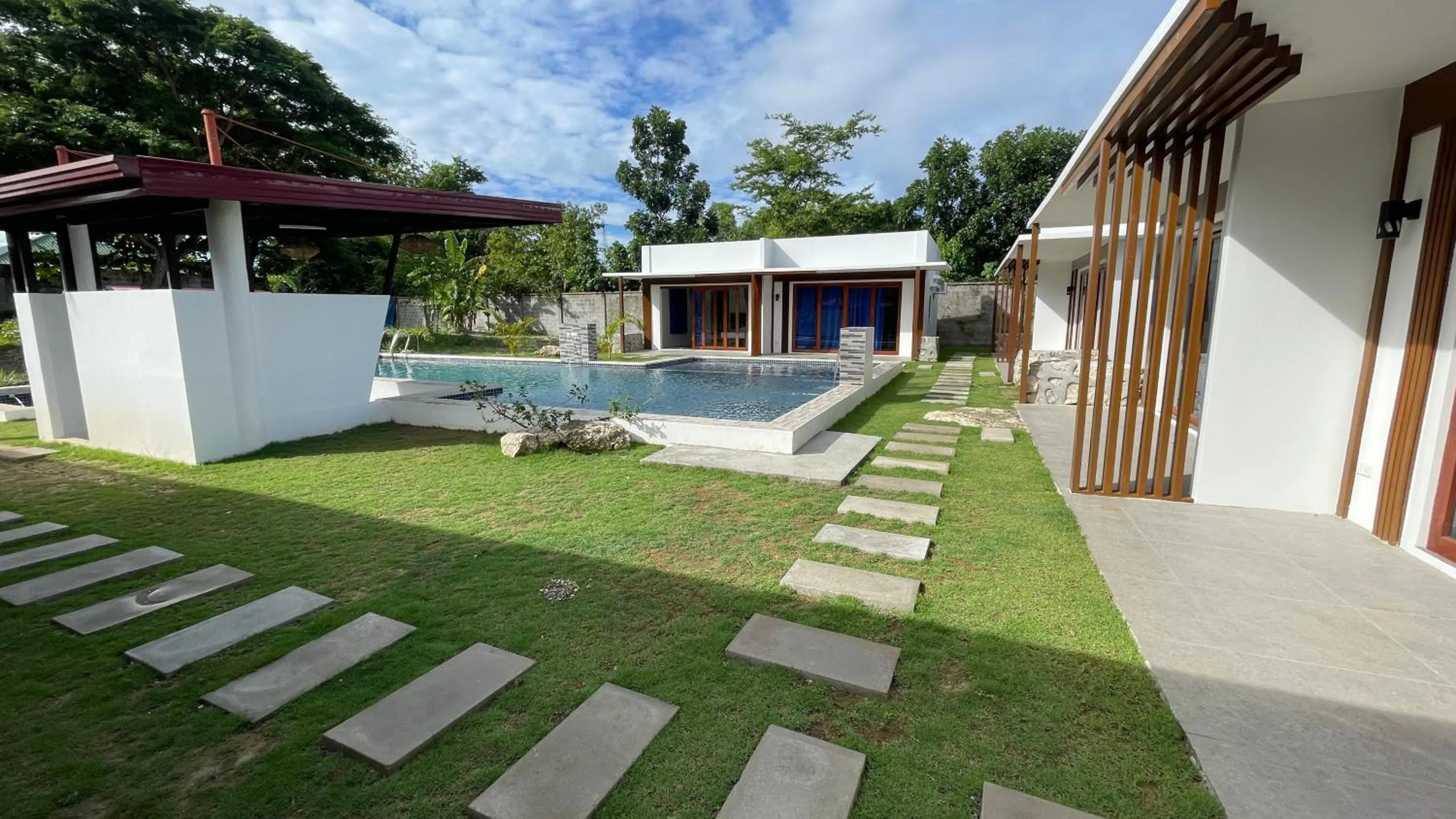 Swimming pool in Bluewaves Hostel & Villa Panagsama by Hiverooms