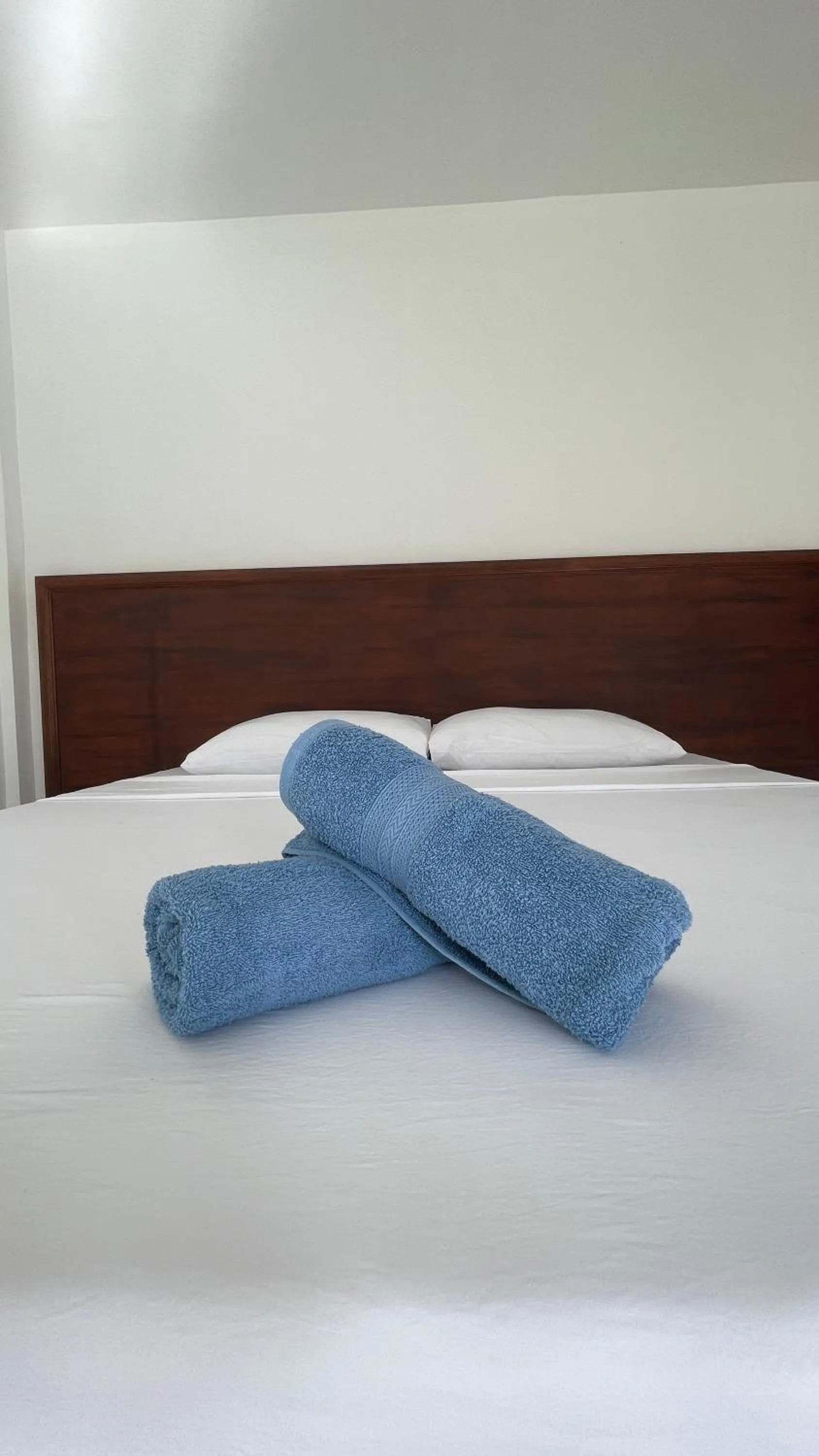towels, Bed in Bluewaves Hostel & Villa Panagsama by Hiverooms